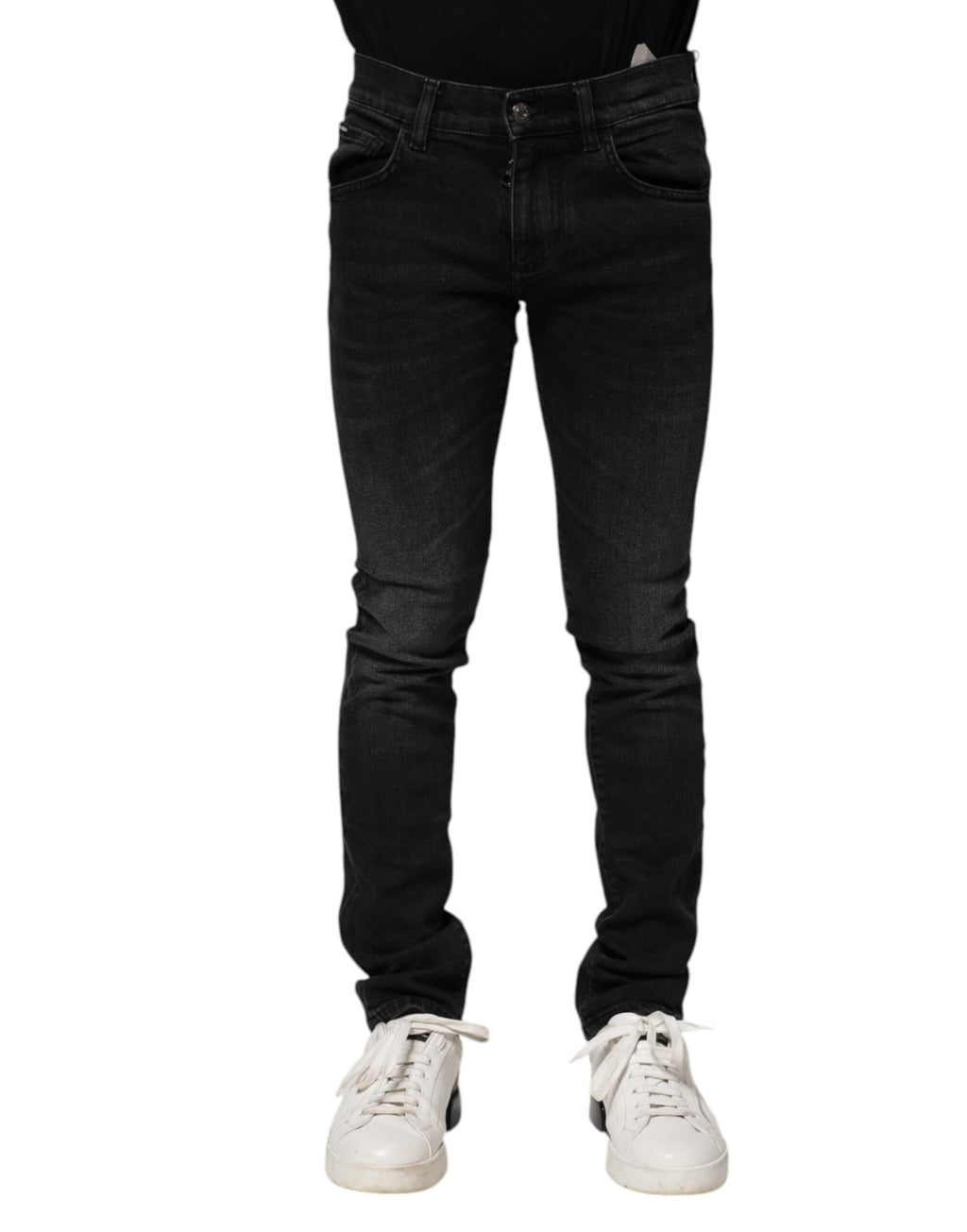 Jeans homme en denim skinny noir Dolce & Gabbana en coton, ajustés et stylés, visibles en gros plan.