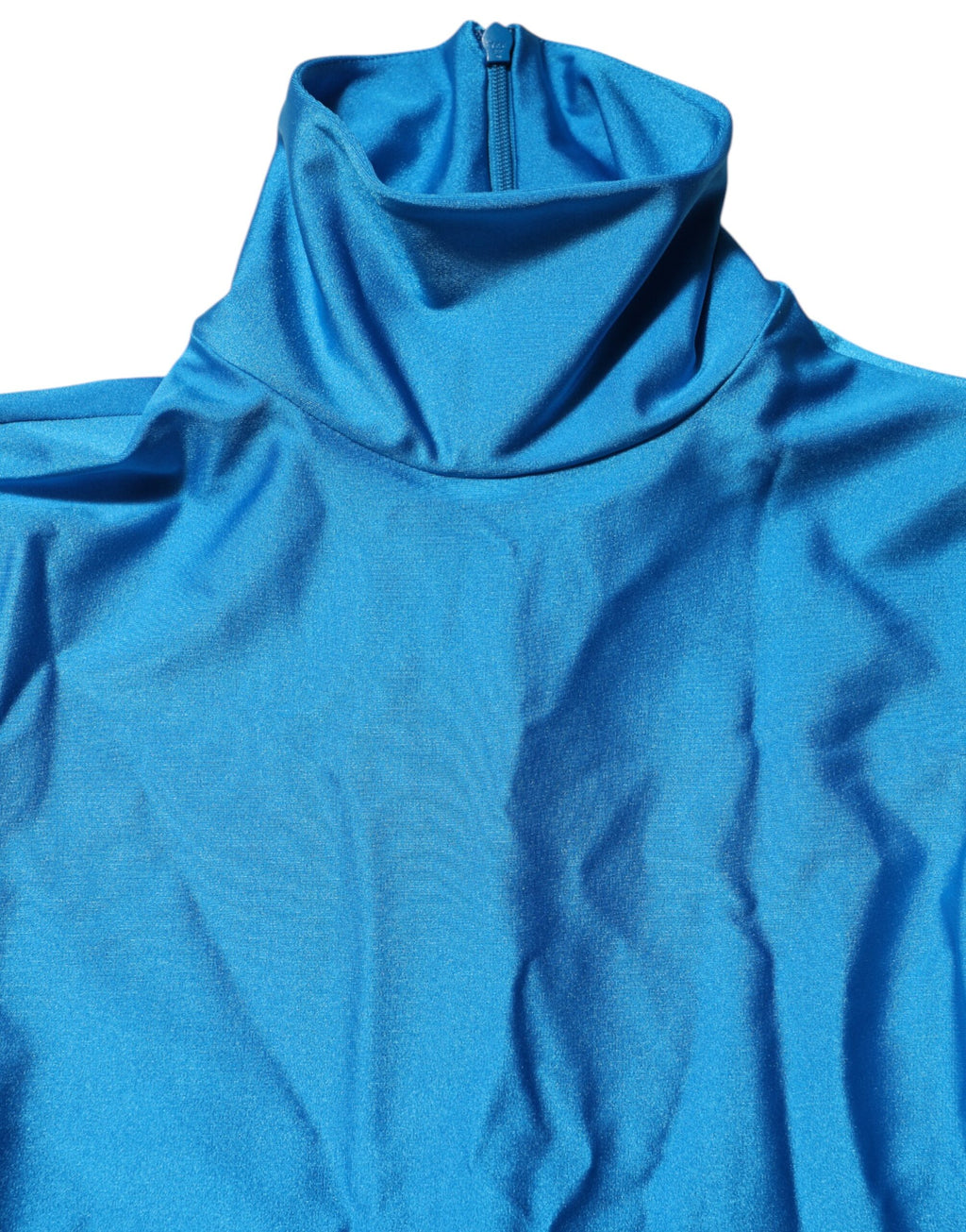 Combinaison moulante en nylon bleu Dolce & Gabbana avec col roulé, ajustée et élégante, vue de face.