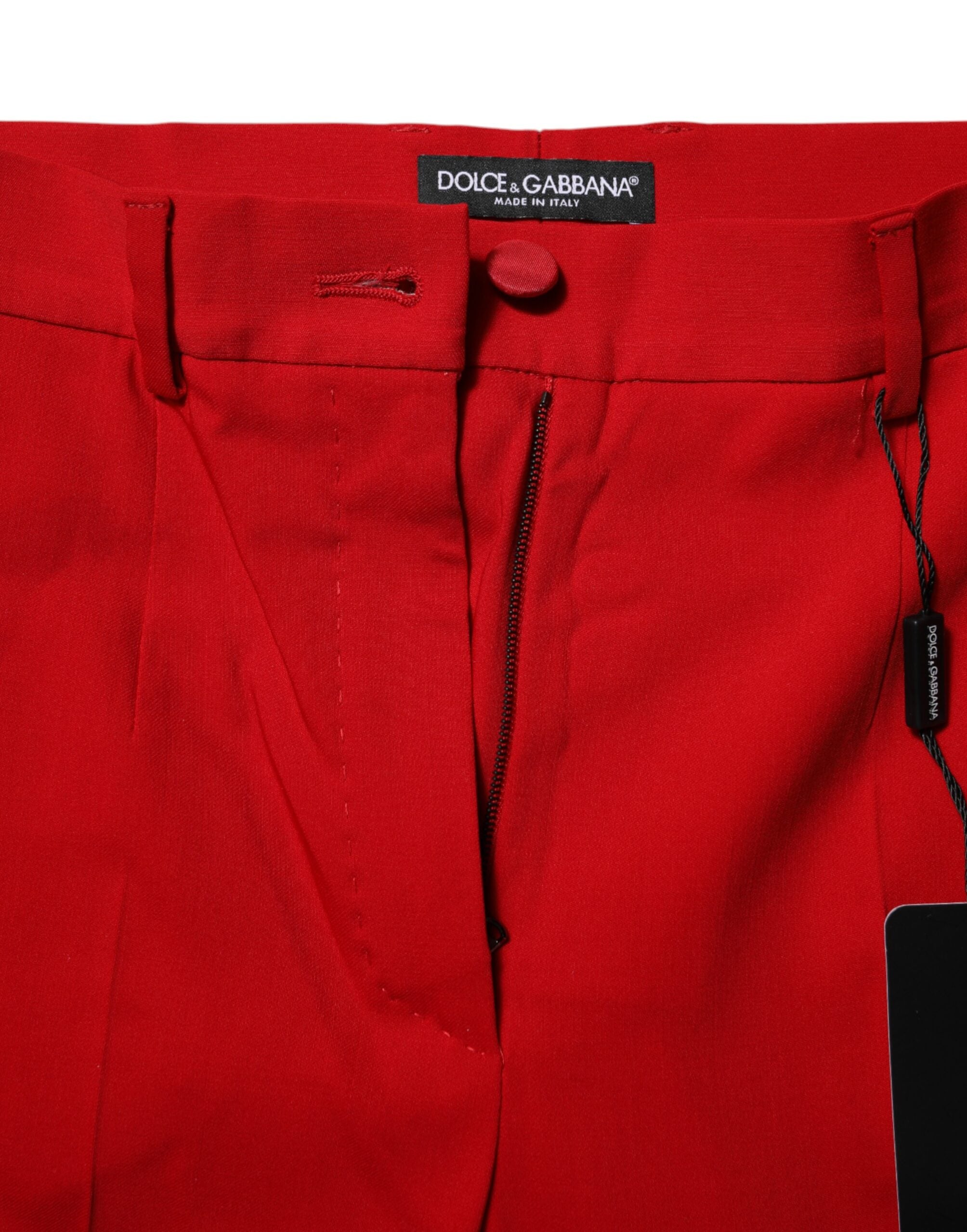 Pantalons en laine rouge Dolce & Gabbana, taille moyenne, coupe tapered, vue de face sur un fond neutre.