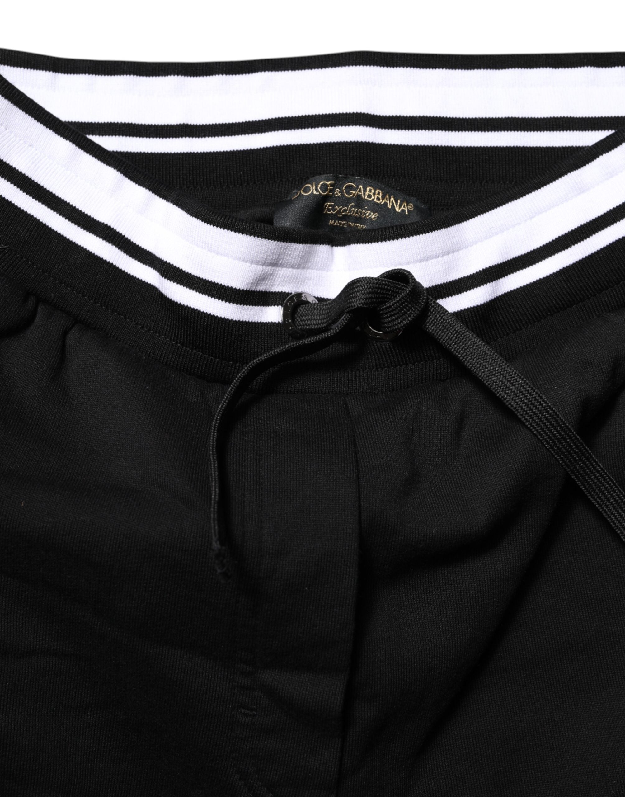Pantalons joggers en coton noir Dolce & Gabbana à taille moyenne, style décontracté et moderne, visible sur l'image.