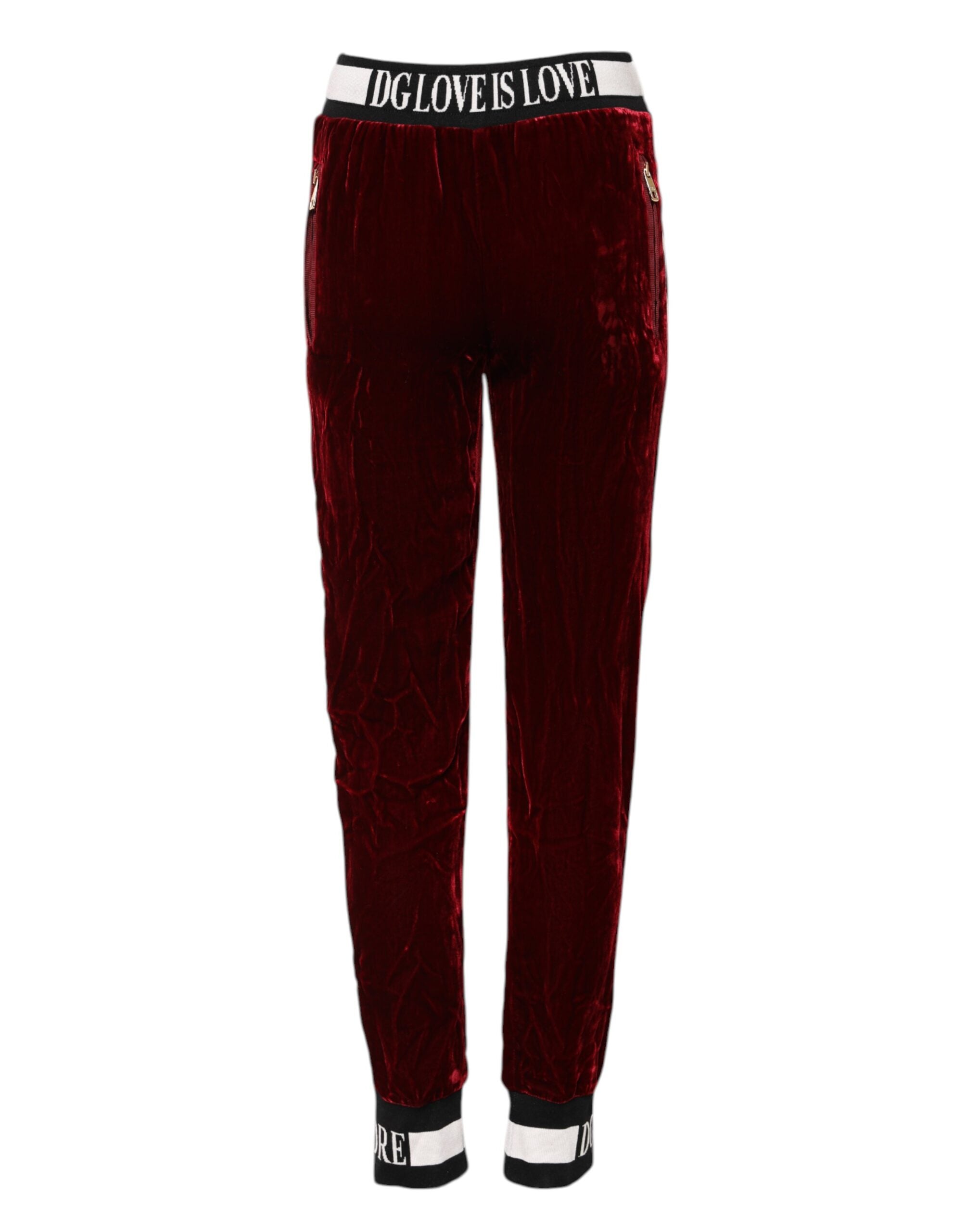 Pantalons Dolce & Gabbana en viscose rouge avec logo DG à la taille mi-haute, vue de face.