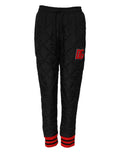Pantalons joggers noirs Dolce & Gabbana à taille moyenne, quiltés et confortables, pour un style décontracté et élégant.