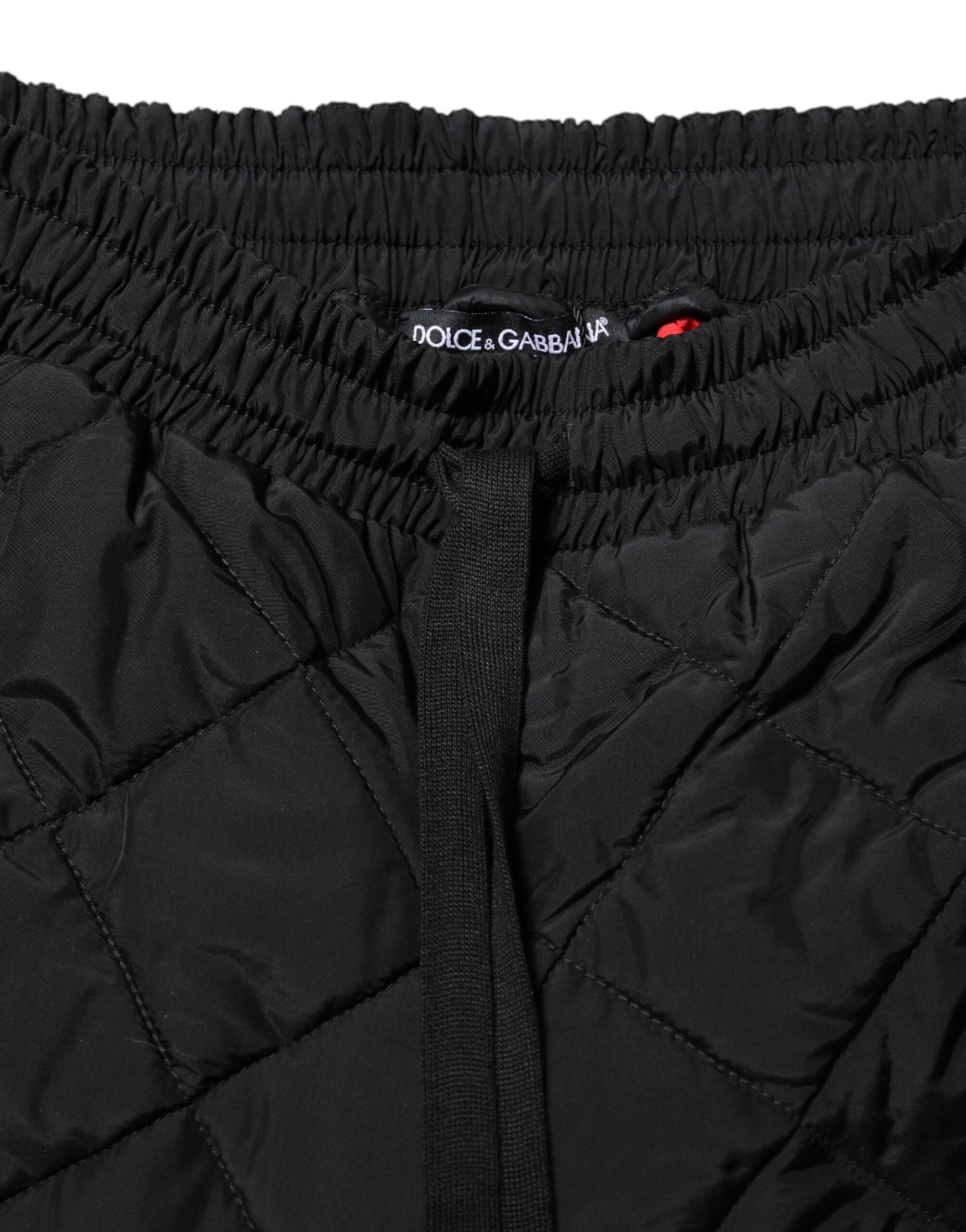 Pantalons joggers noirs Dolce & Gabbana en tissu matelassé à taille moyenne, mode élégante et confortable.
