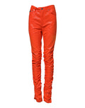 Jeans en denim orange Dolce & Gabbana à taille haute, coupe classique, avec détails en coton, mode chic et tendance.