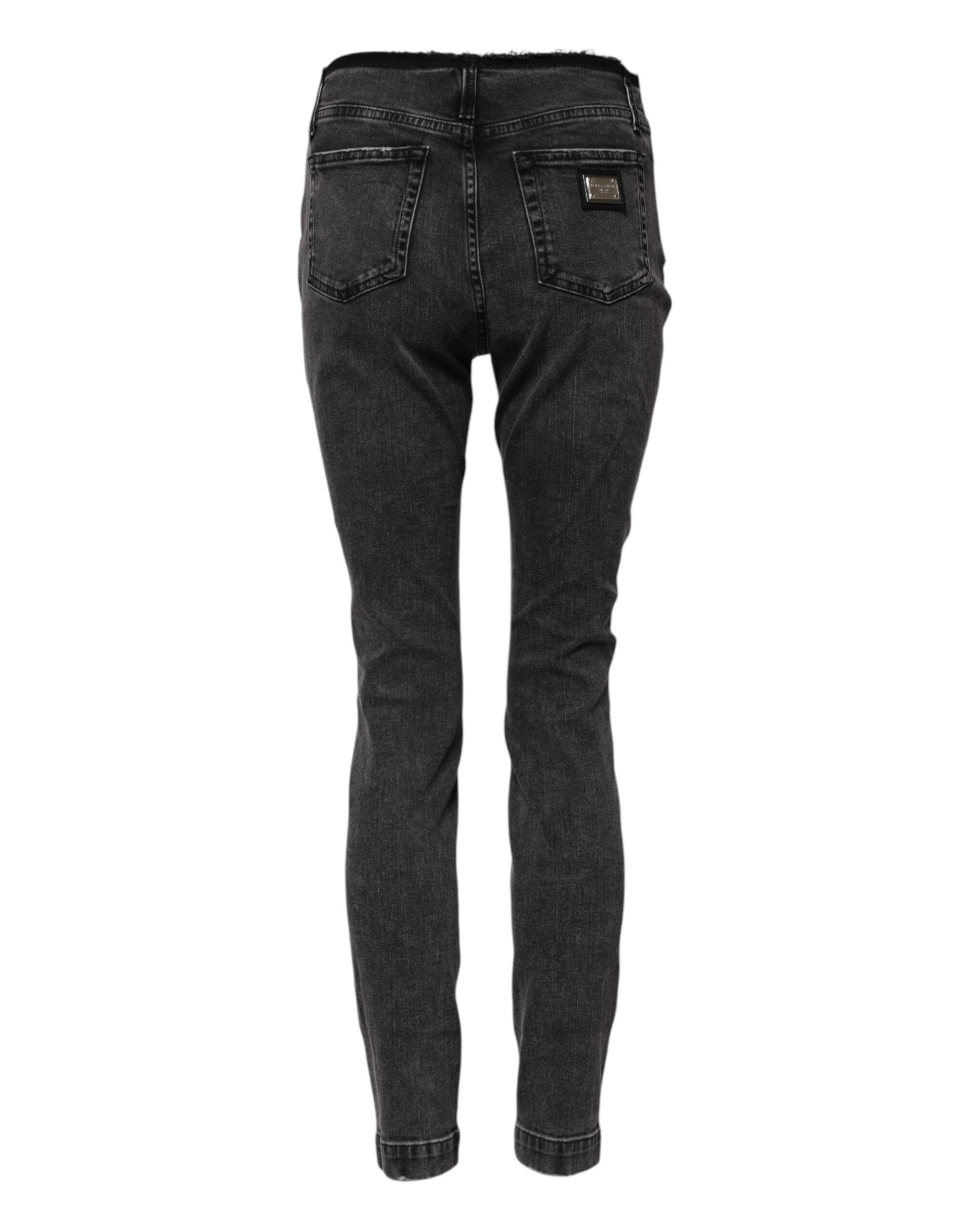 Jeans skinny en coton gris Dolce & Gabbana avec taille moyenne, vue de face, détails visibles sur le denim.