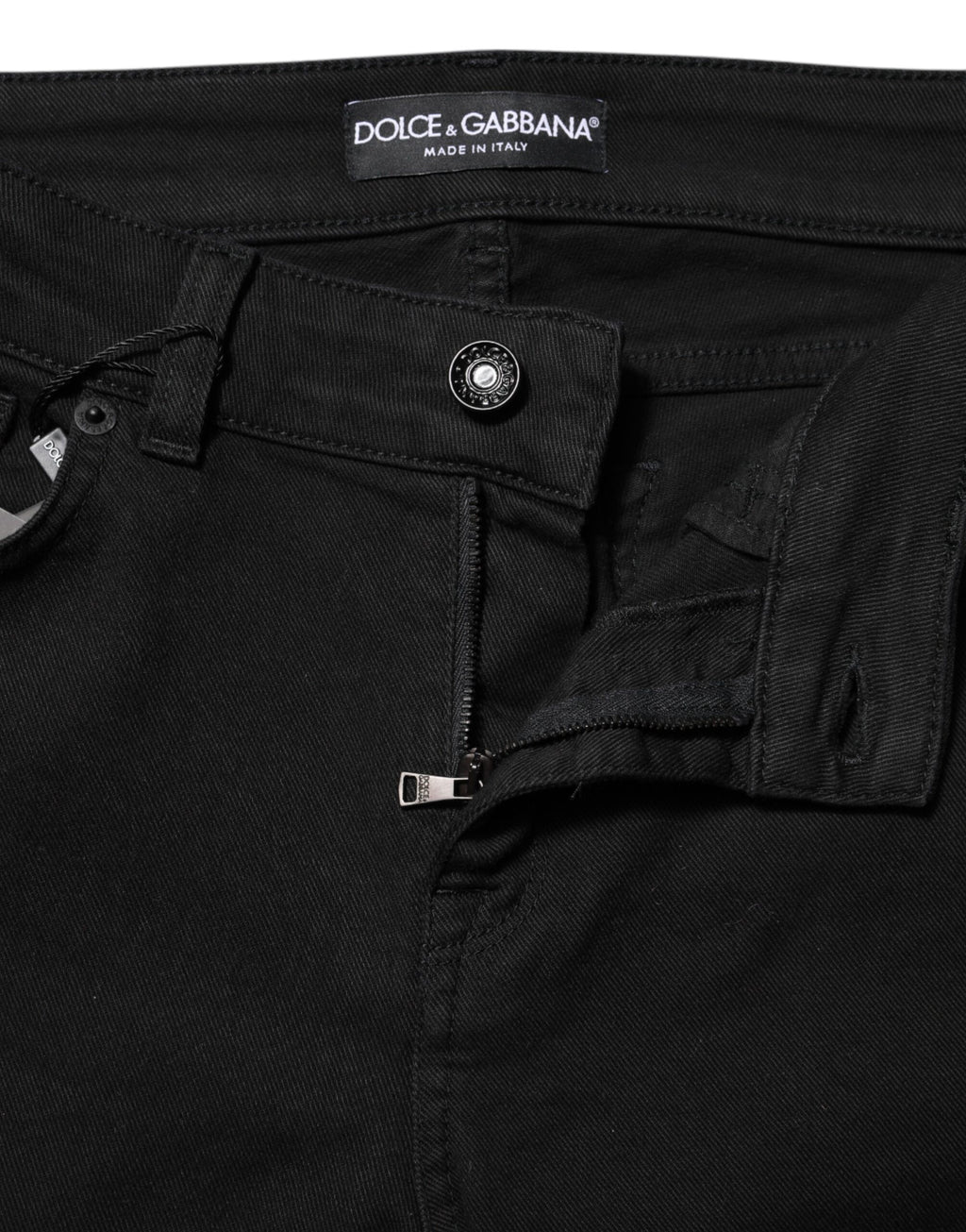 Jeans skinny noir en coton Dolce & Gabbana, taille moyenne, coupe ajustée et moderne, visibles sur l'image.