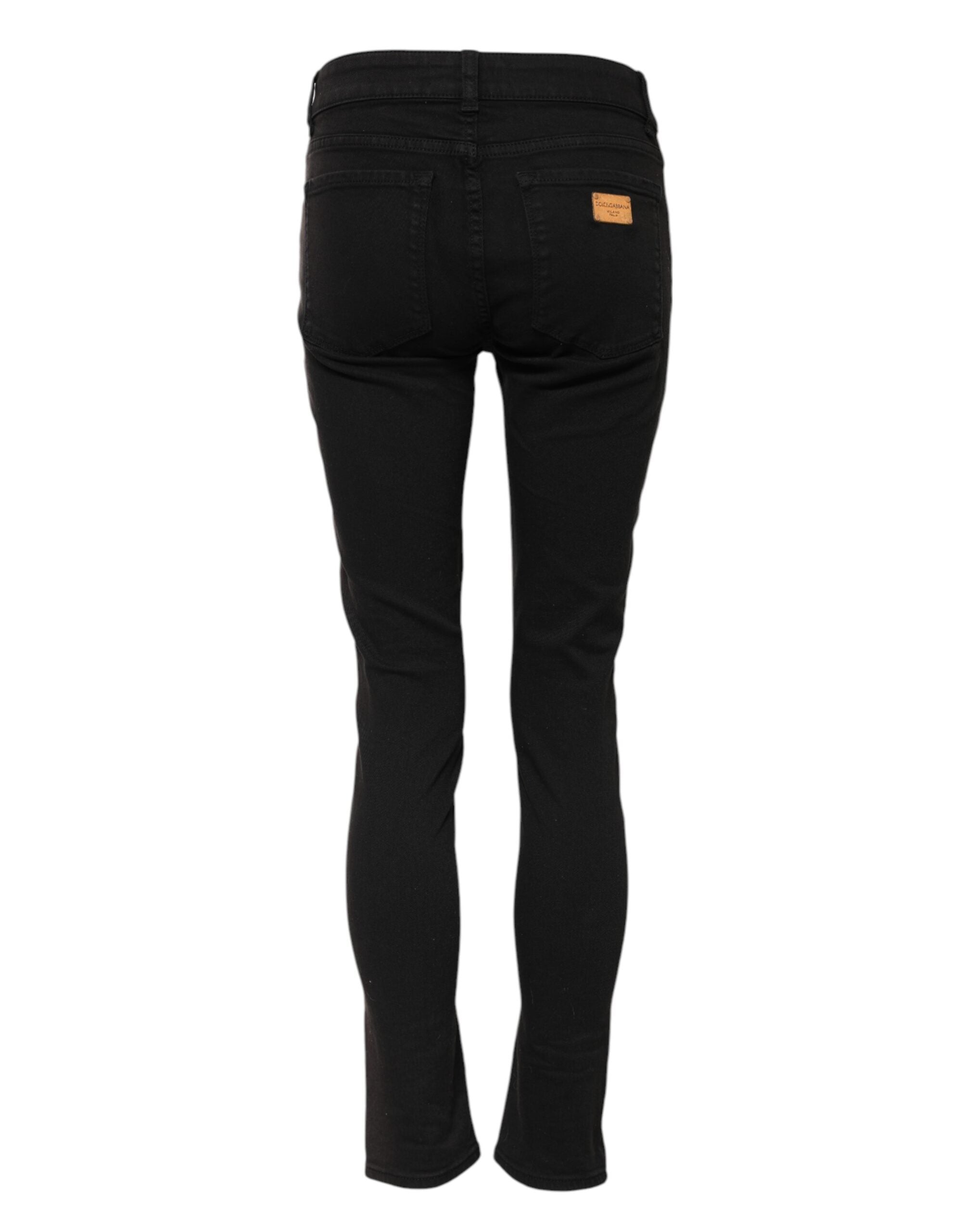 Jean skinny noir en coton Dolce & Gabbana, taille mi-haute, coupe ajustée, visible en détail sur l'image.