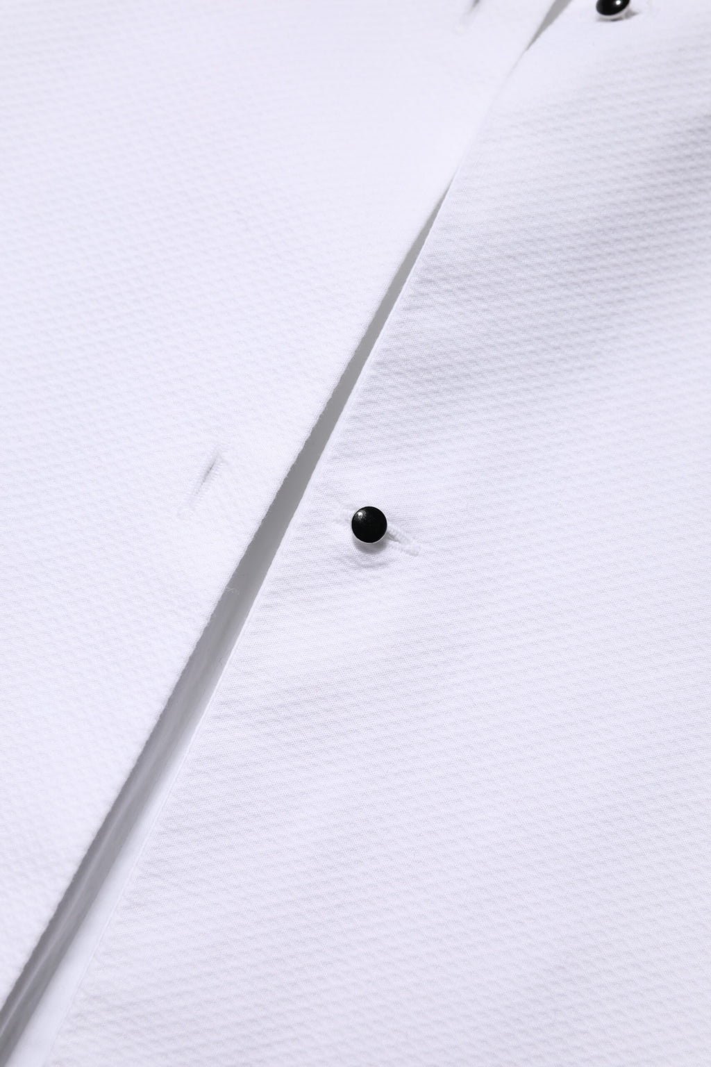 Chemise blanche à manches longues et col en coton de Dolce & Gabbana, vue détaillée du haut élégant.