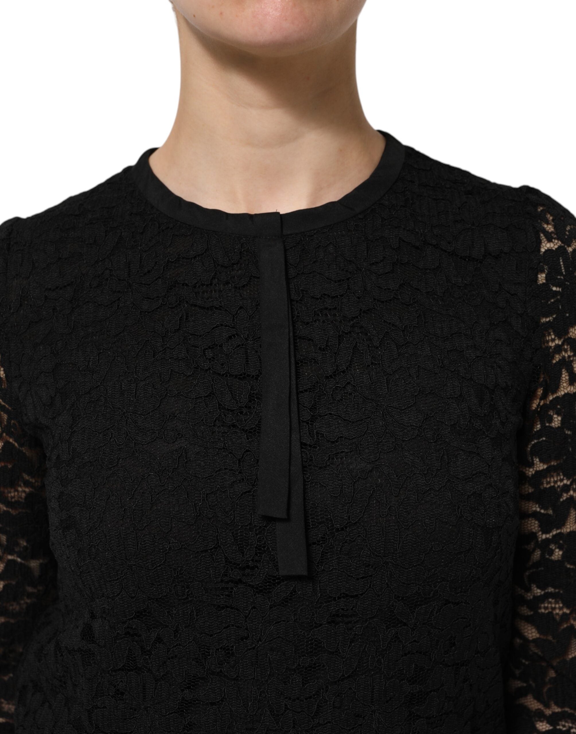 Chemise noire en nylon et dentelle de Dolce & Gabbana, manches longues élégantes, détail sophistiqué.
