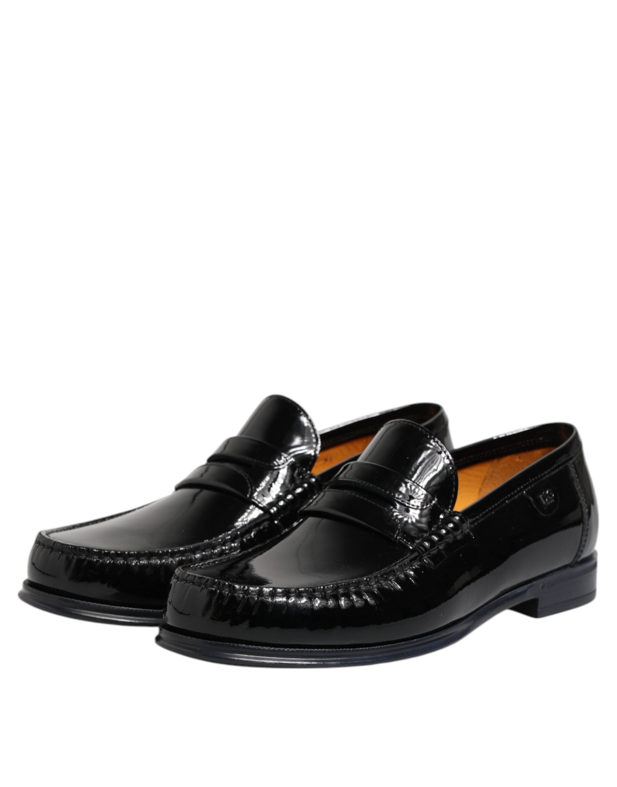 Chaussures habillées en cuir noir Dolce & Gabbana, loafers slip-on élégants, vue de face avec détails de finition raffinés.