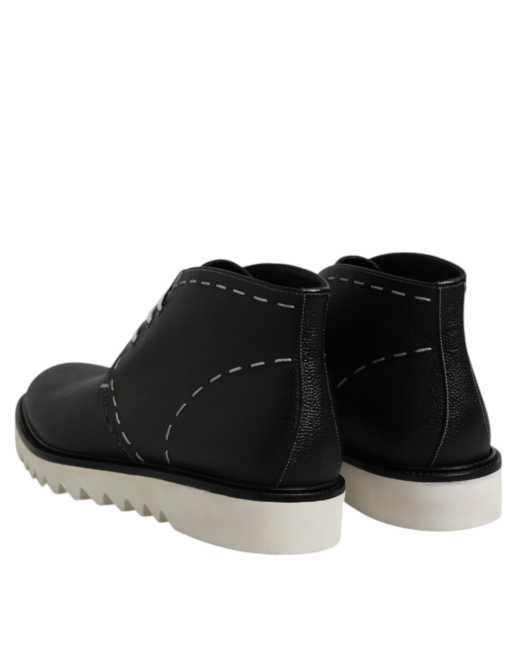 Bottes ankle en cuir noir et blanc Dolce & Gabbana, chaussures élégantes pour femme, vue de côté.