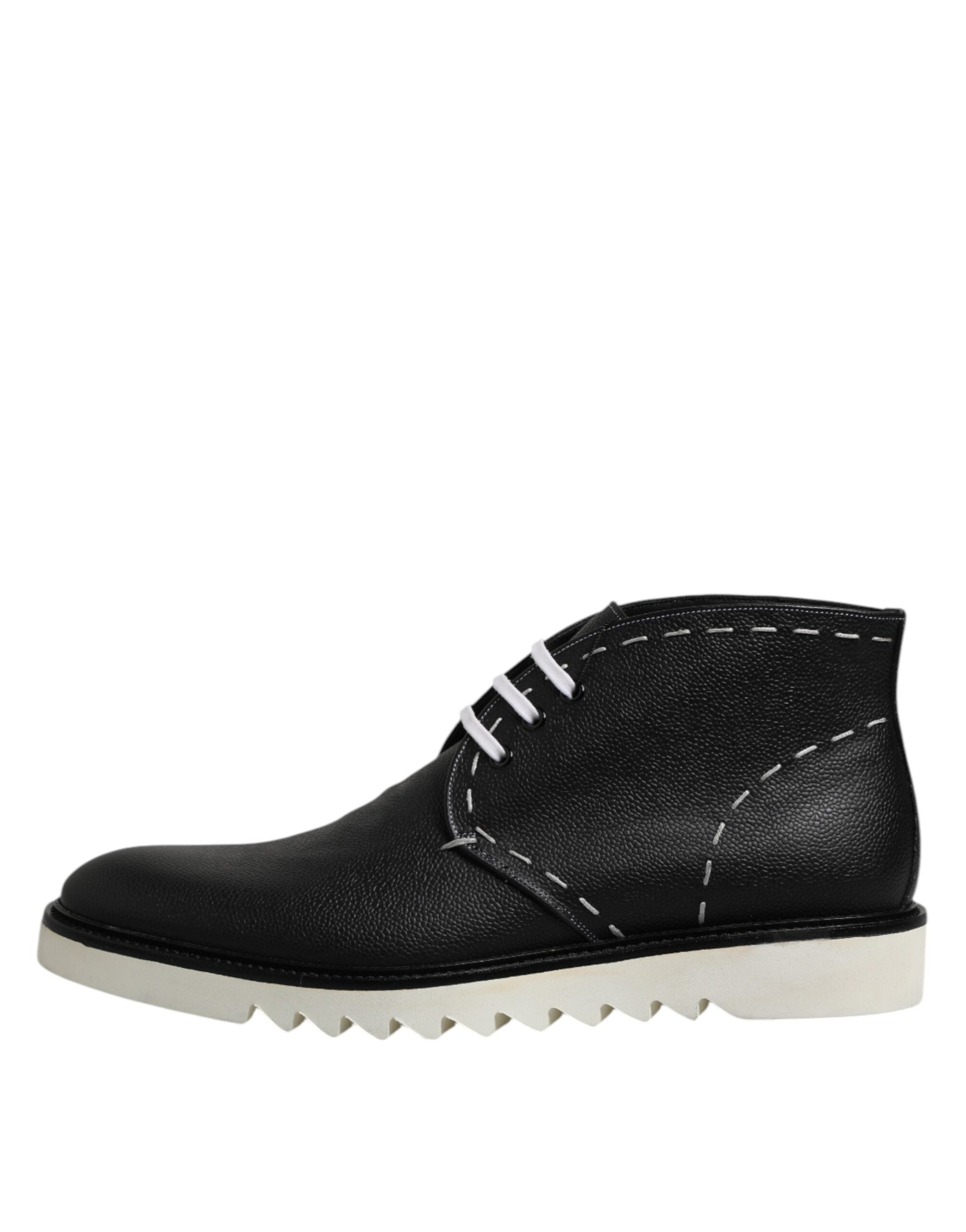 Bottes ankle en cuir noir et blanc de Dolce & Gabbana, chaussures élégantes avec semelle en cuir et détails sophistiqués.