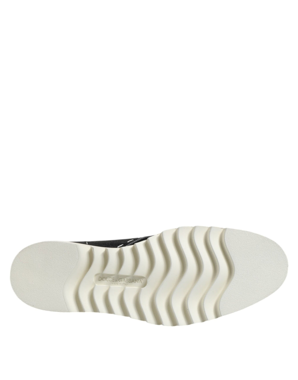 Bottines en cuir noir et blanc Dolce & Gabbana, chaussures élégantes pour femme, visibles avec détails de la texture en cuir.