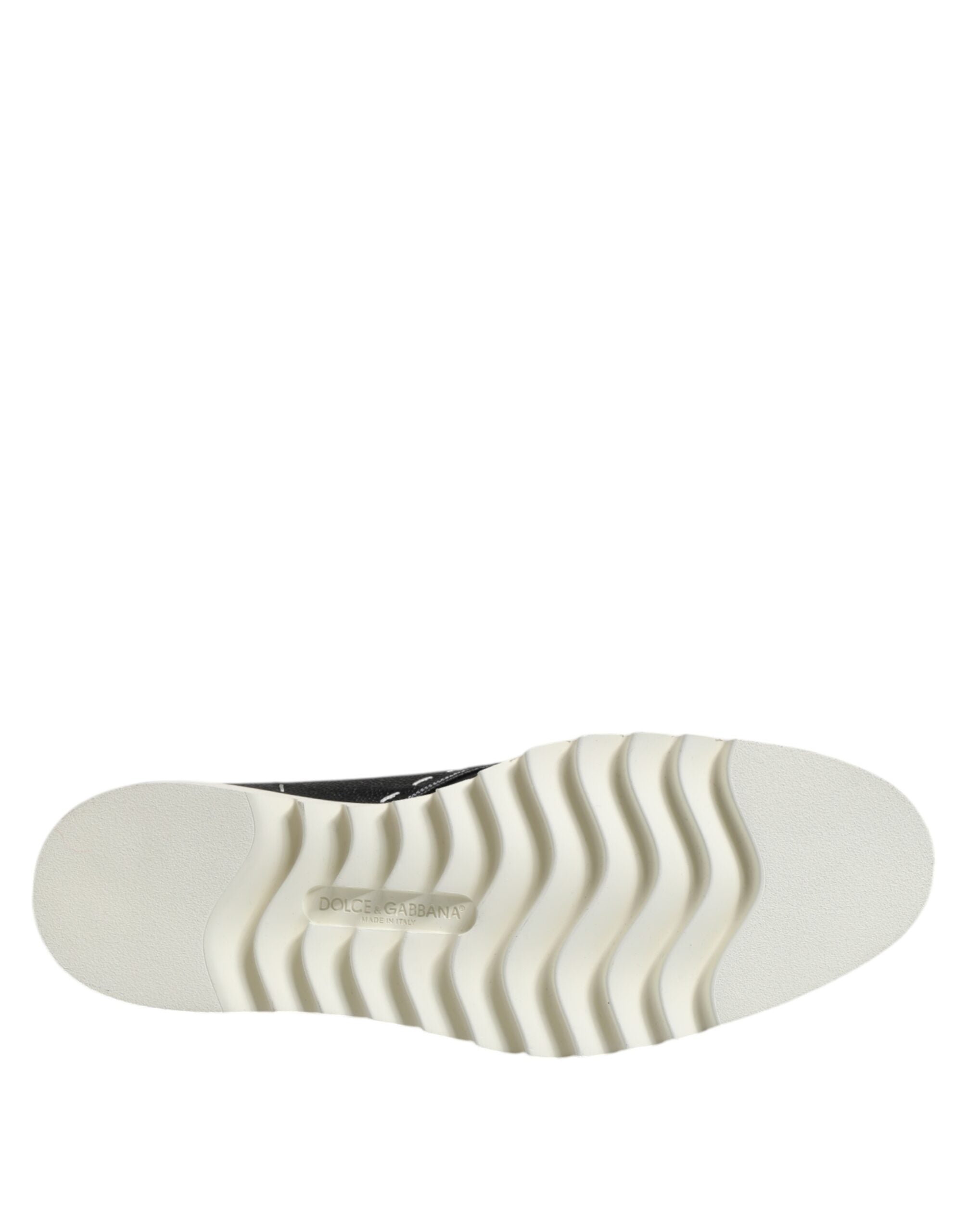 Bottines en cuir noir et blanc Dolce & Gabbana, chaussures élégantes pour femme, visibles avec détails de la texture en cuir.