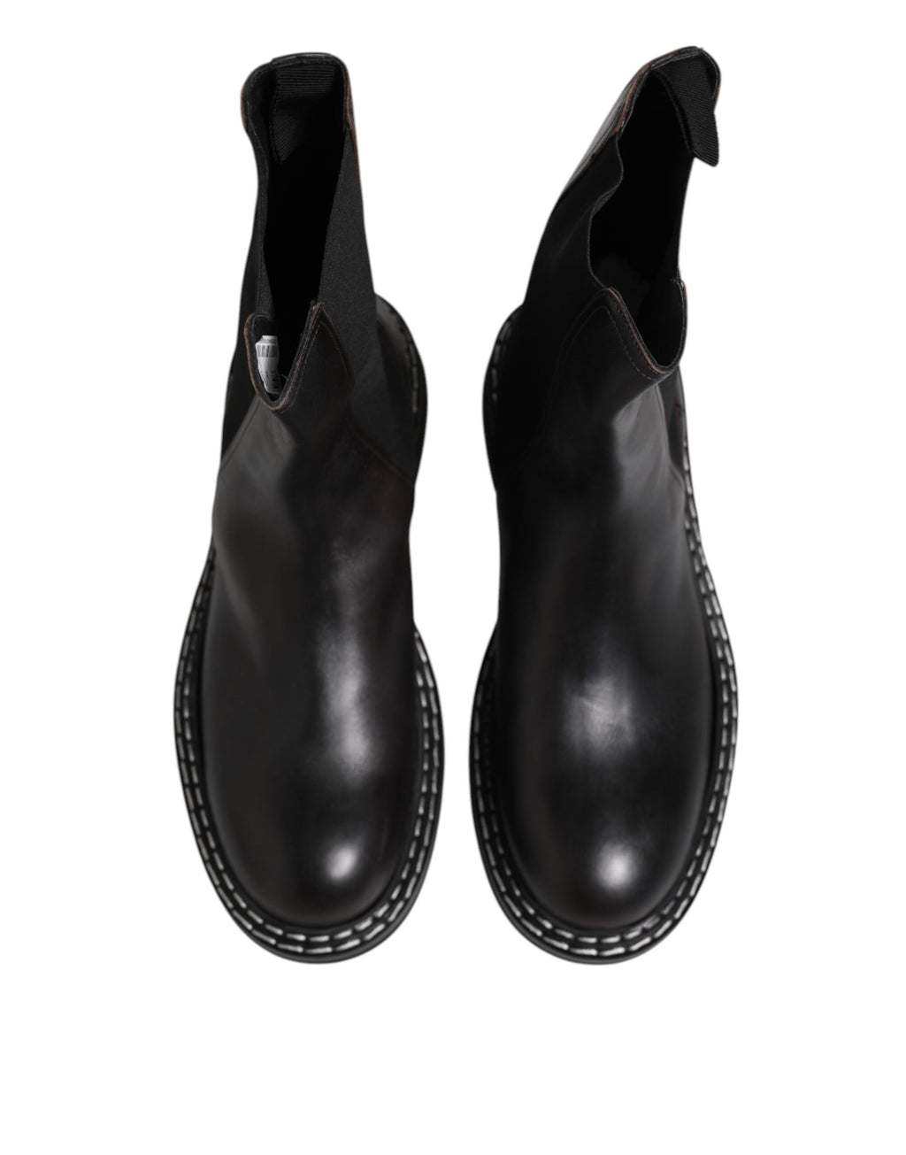 Bottes plates en cuir noir Dolce & Gabbana, mi-mollet, avec design élégant et finition lisse.