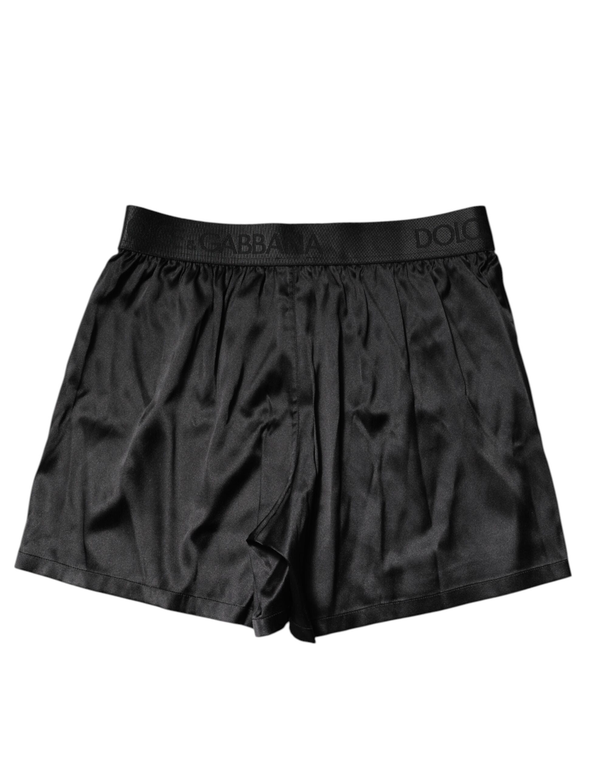 Sous-vêtements boxers Dolce & Gabbana noirs avec logo, taille régulière, en coton, visibles sur l'image.