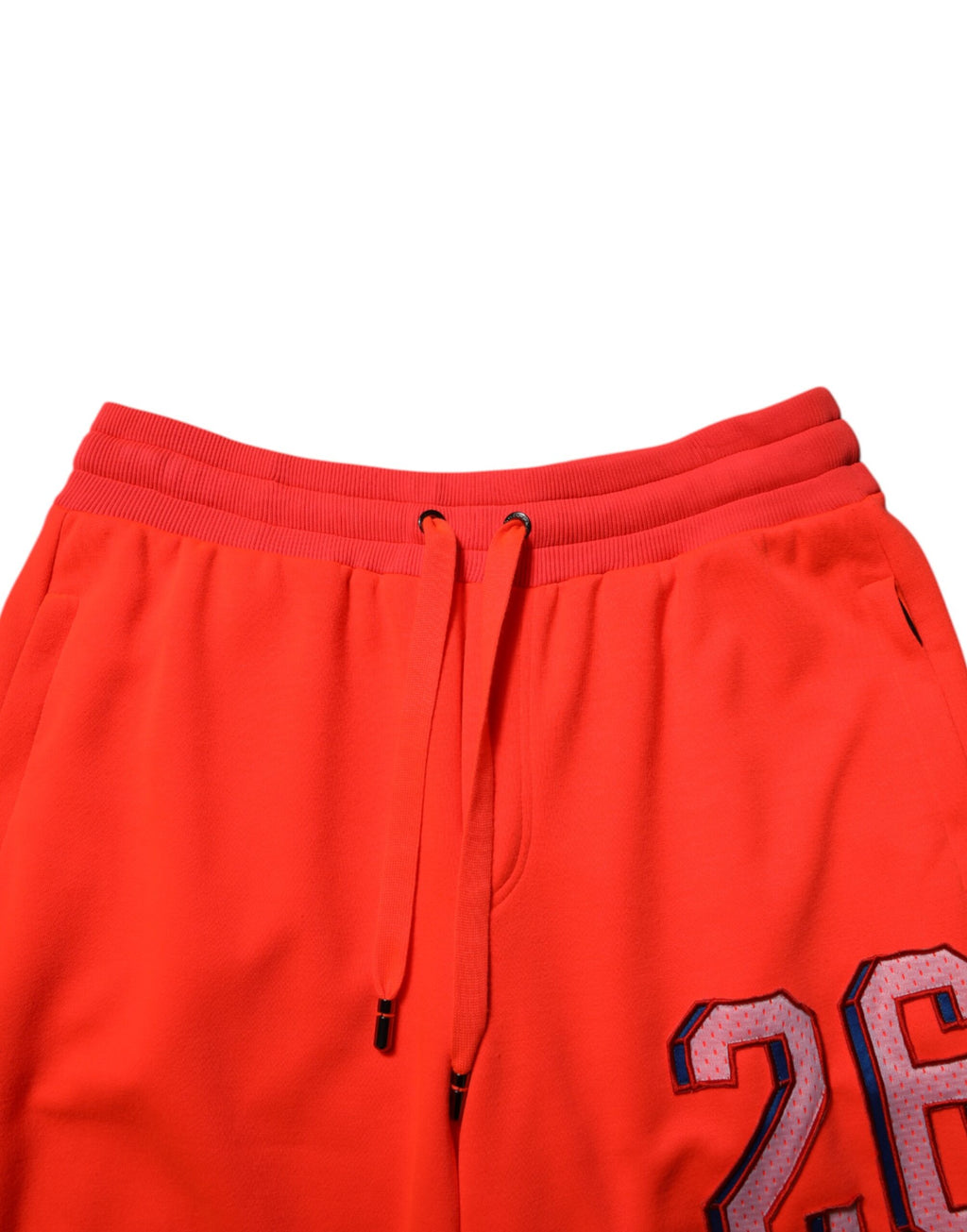 Pantalon de jogging en polyester orange Dolce & Gabbana pour homme, style décontracté et confortable.