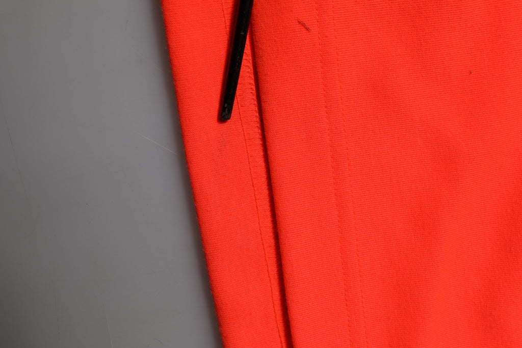 Pantalon de jogging pour homme Dolce & Gabbana en polyester orange avec taille élastique et poches latérales.