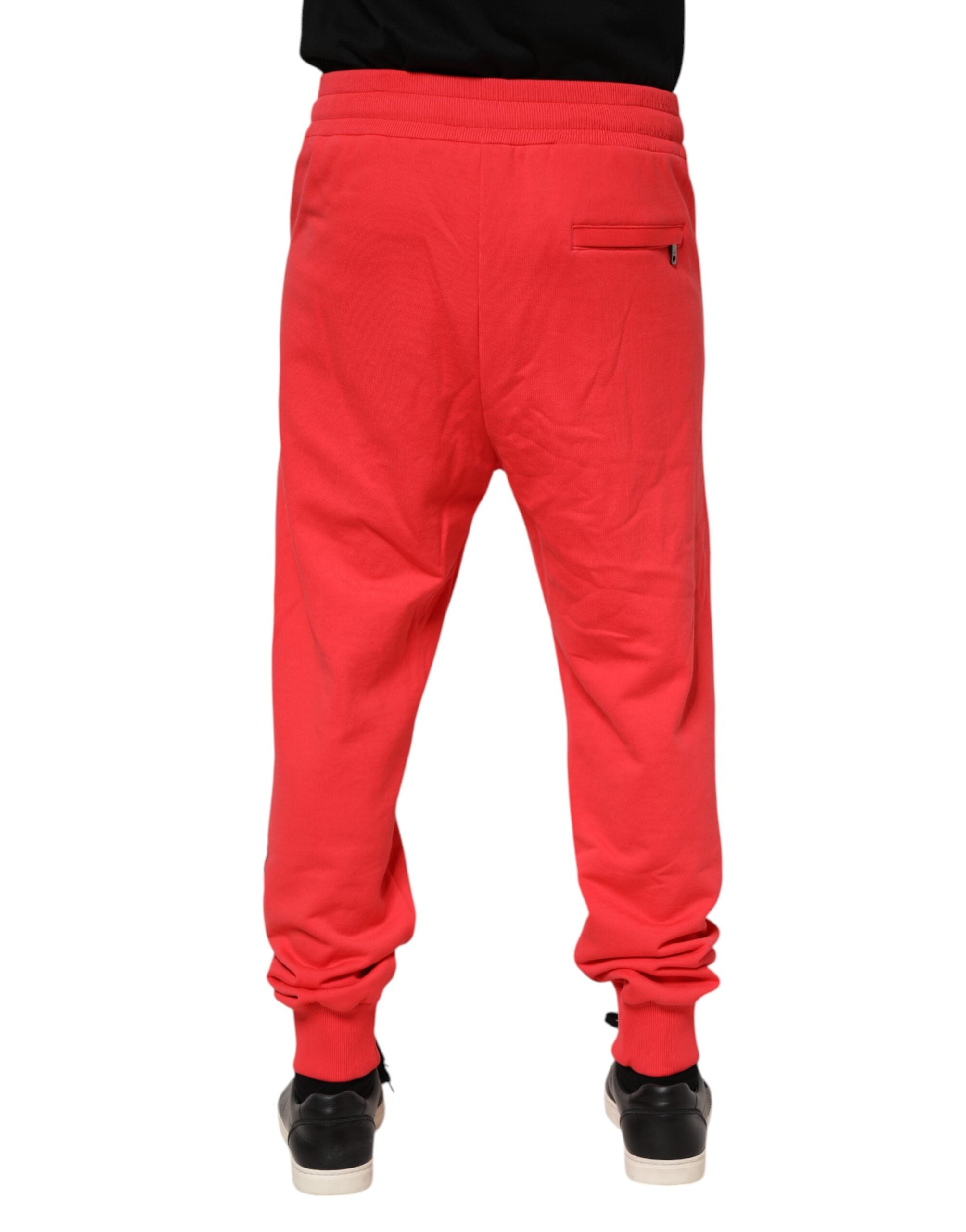 Pantalon jogging rouge en coton pour homme de Dolce & Gabbana, pantalon décontracté avec taille élastique et poches latérales.