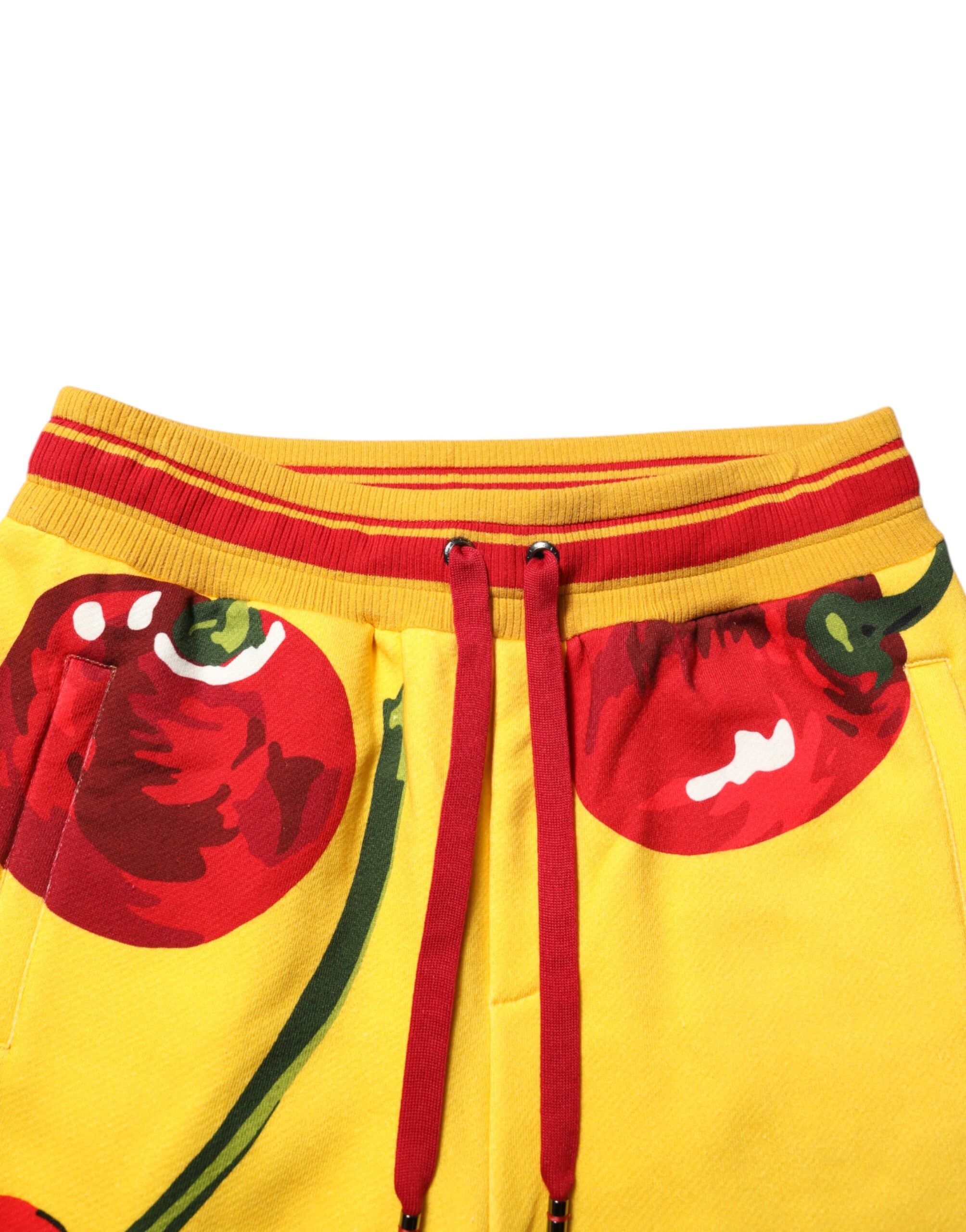 Pantalon de jogging Dolce & Gabbana avec imprimé cerises jaunes, pantalon de sport confortable et tendance.