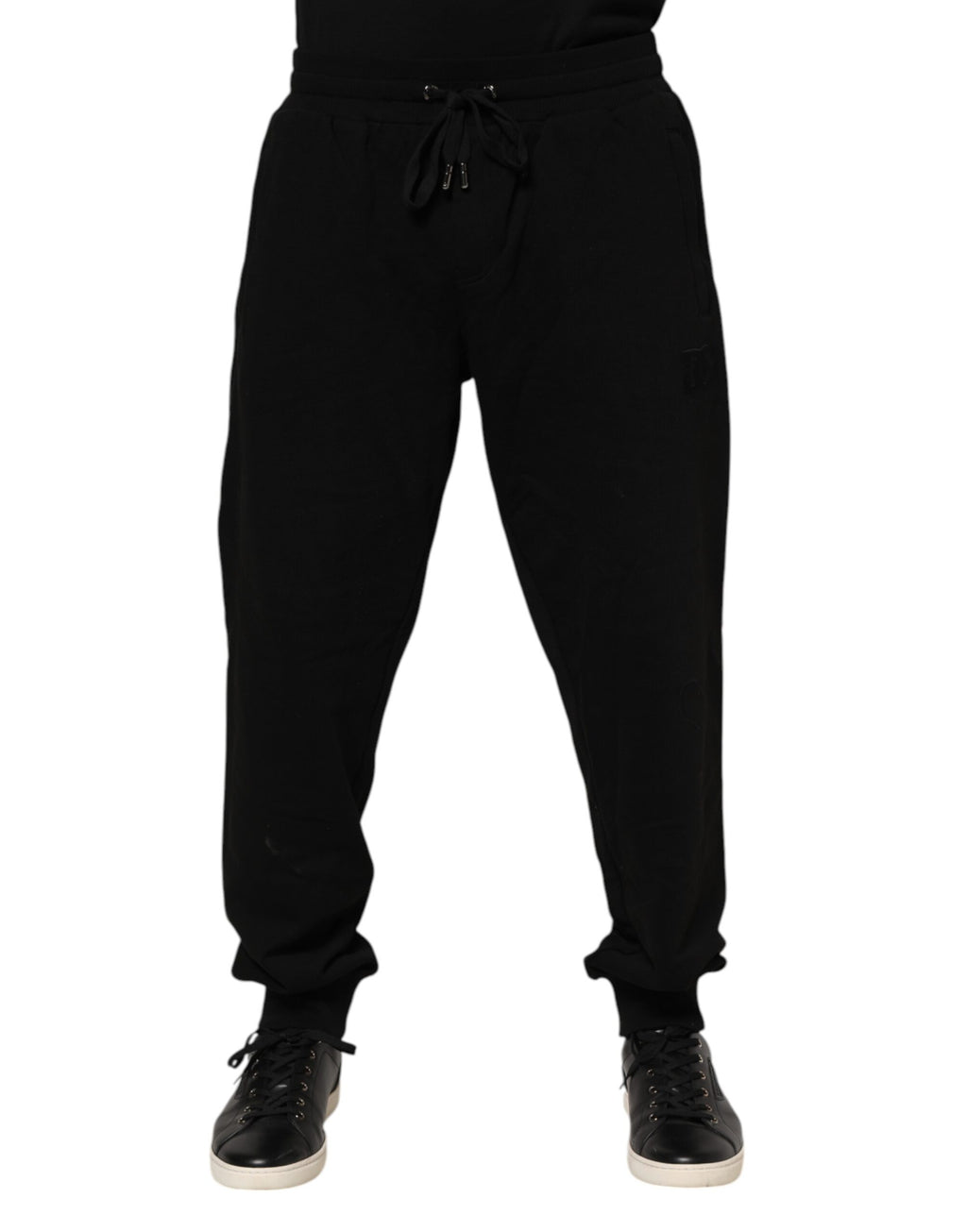 Pantalons joggers pour homme Dolce & Gabbana en coton noir avec bande logo, décontractés et élégants.