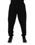 Pantalons joggers pour homme Dolce & Gabbana en coton noir avec bande logo, décontractés et élégants.