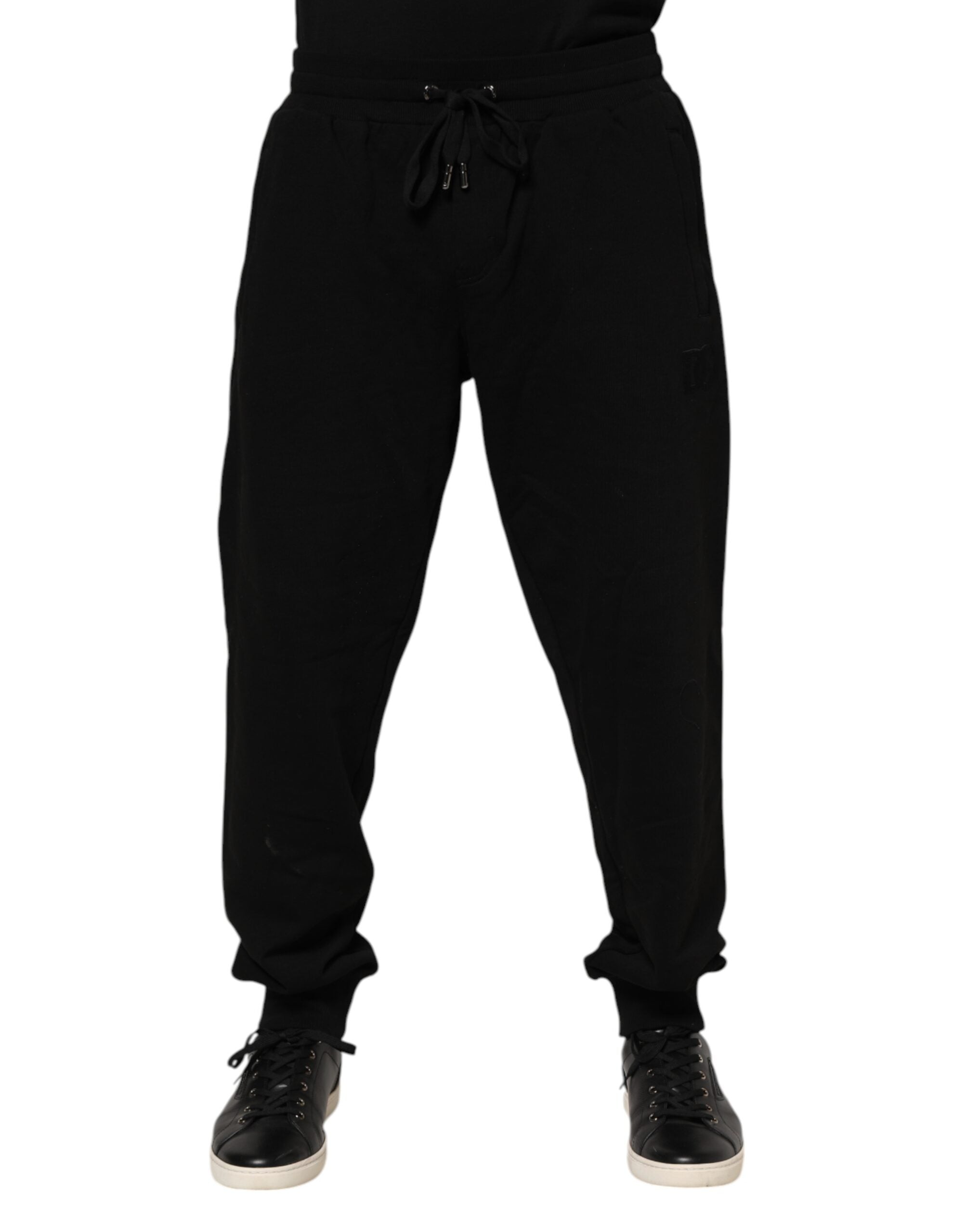 Pantalons joggers pour homme Dolce & Gabbana en coton noir avec bande logo, décontractés et élégants.