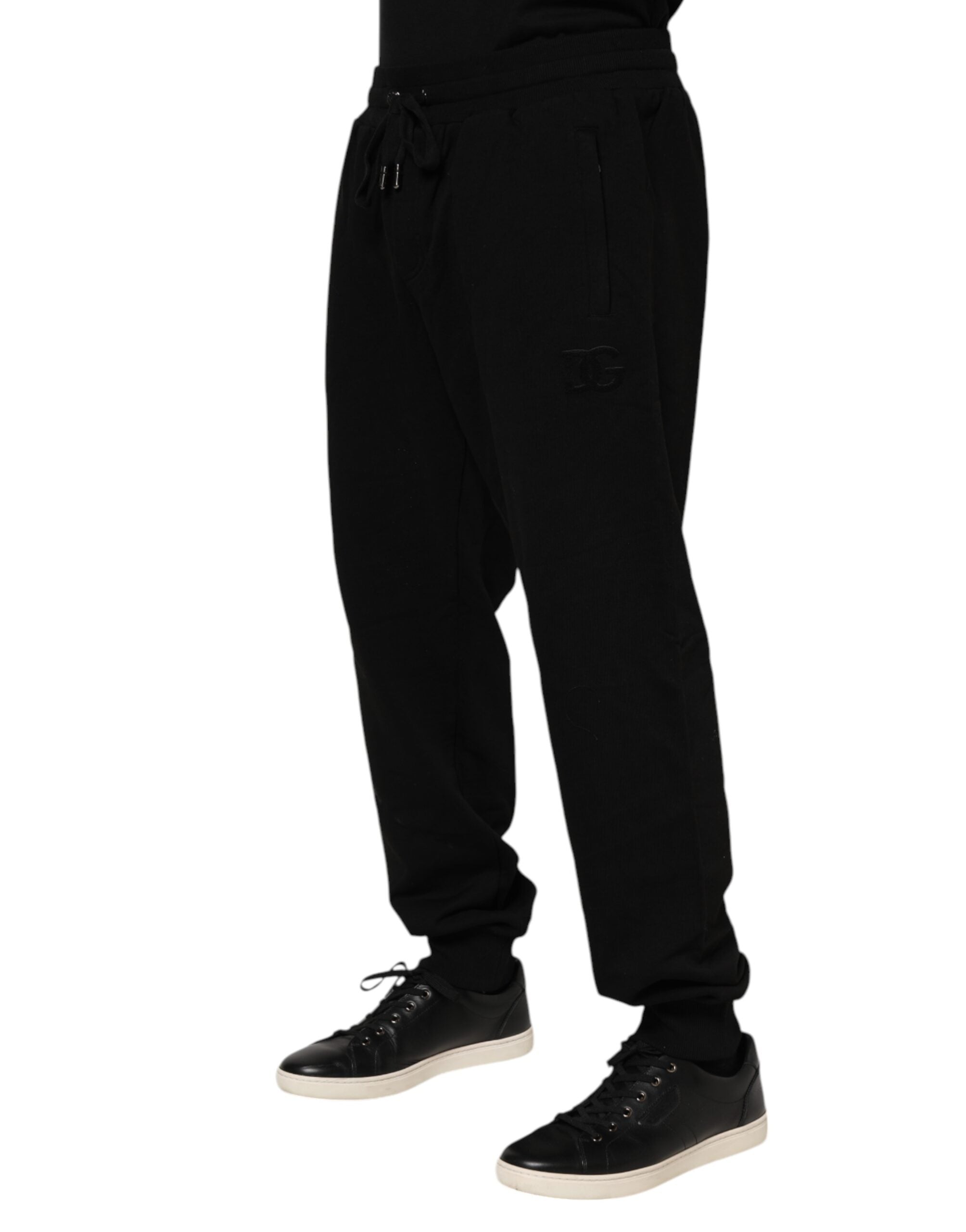 Pantalons jogger pour homme Dolce & Gabbana en coton noir avec bande logo, style décontracté et moderne.