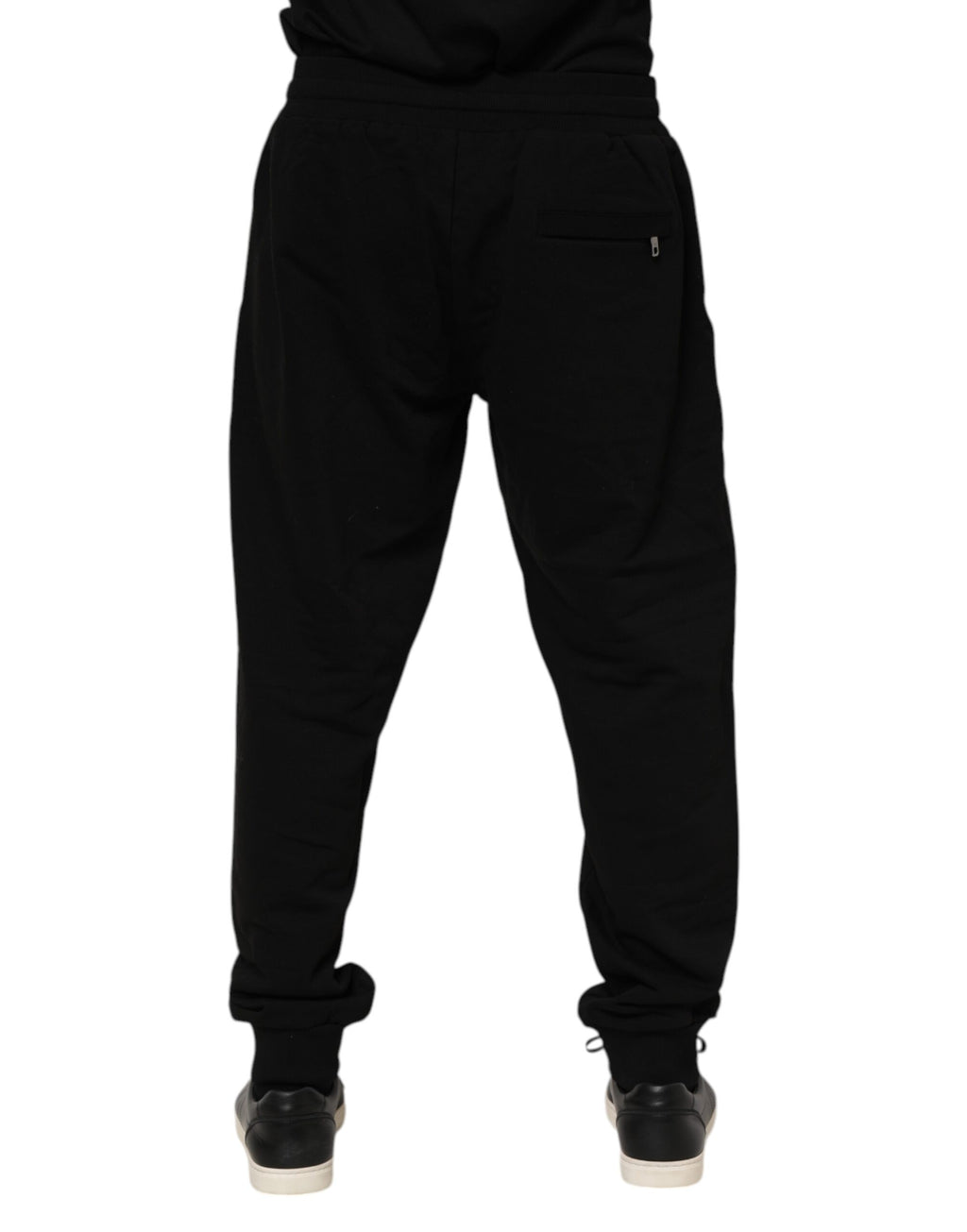 Pantalon jogger pour homme Dolce & Gabbana en coton noir avec bande logo, style décontracté et moderne.
