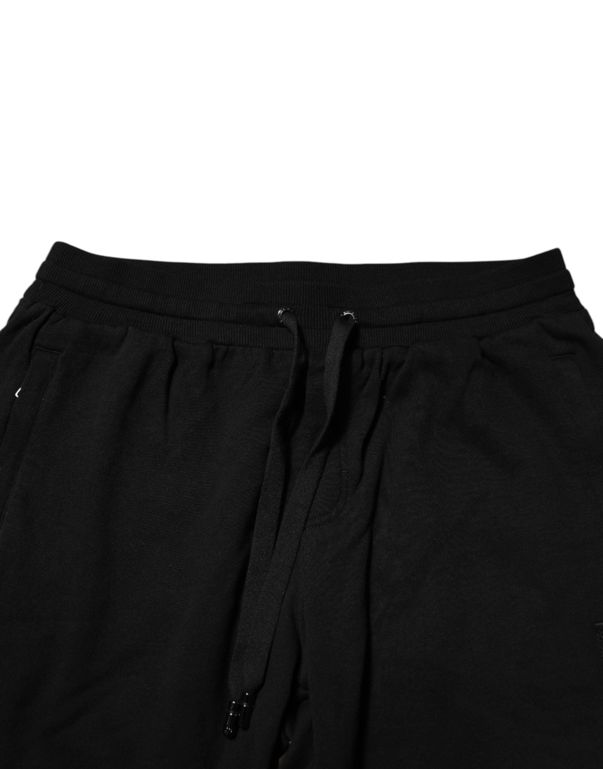 Pantalons joggers pour homme Dolce & Gabbana en coton noir avec bande logo, décontractés et confortables.