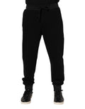 Pantalon jogger Dolce & Gabbana en coton noir avec motif couronne, style décontracté et confortable.