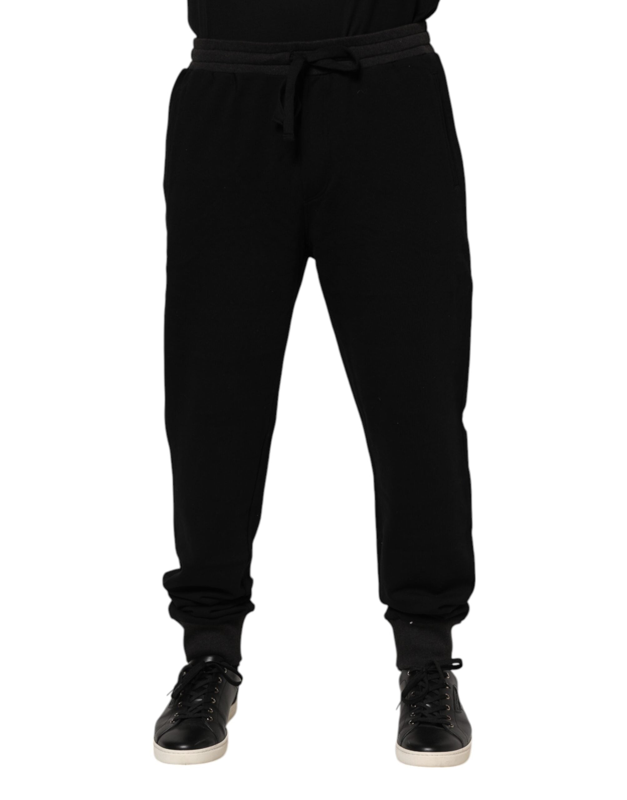 Pantalon jogger Dolce & Gabbana en coton noir avec couronne imprimée, coupe décontractée et détails élégants.