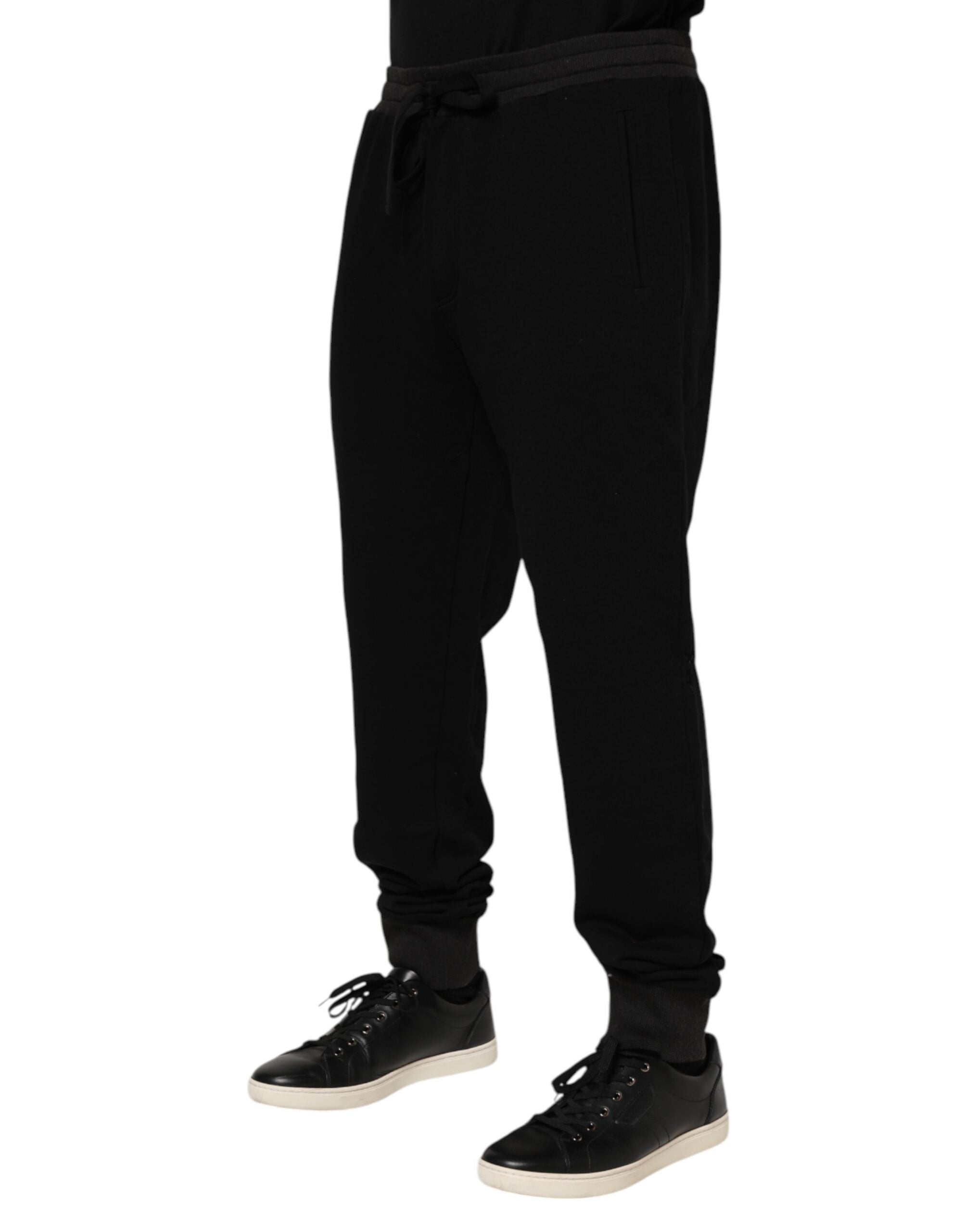 Pantalon de jogging Dolce & Gabbana noir en coton avec ceinture en forme de couronne, style décontracté et élégant.