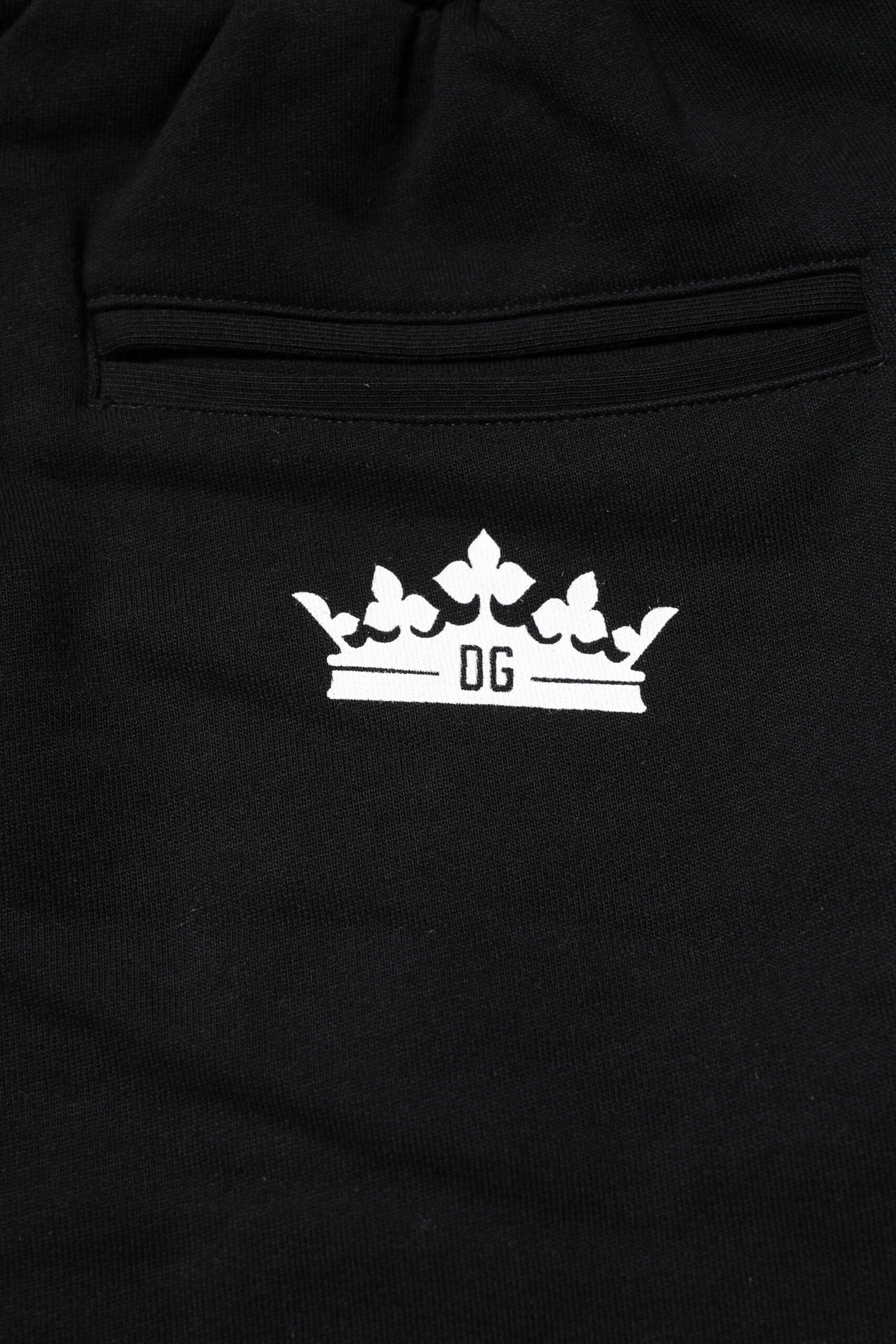 Pantalons joggers Dolce & Gabbana en coton noir avec motif couronne, style décontracté et élégant.