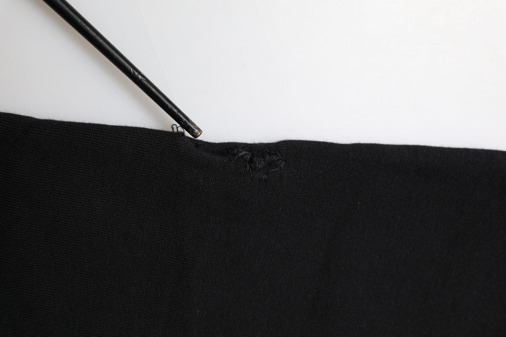 Pantalon jogger Dolce & Gabbana en coton noir avec ceinture en forme de couronne, style décontracté et moderne.