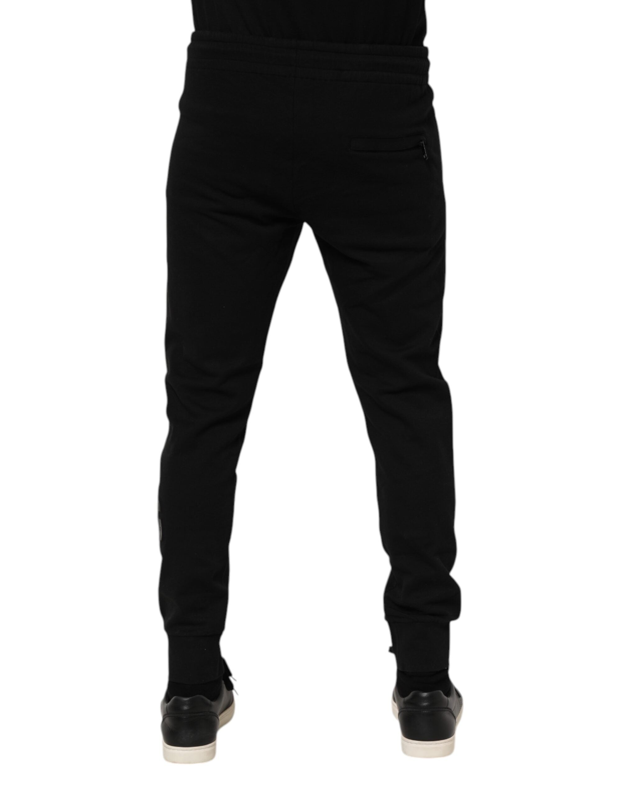 Pantalon jogging homme en coton noir de Dolce & Gabbana, style décontracté et confortable, avec détails de marque.