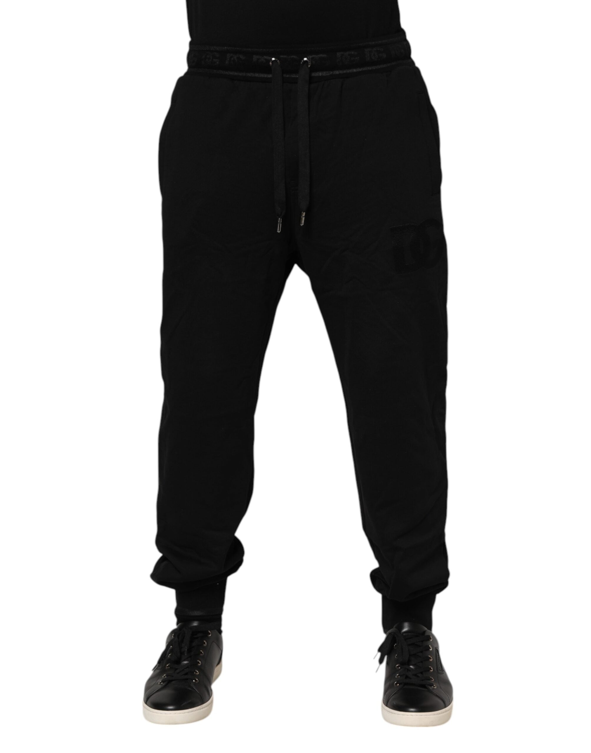 Pantalons joggers en coton noir Dolce & Gabbana avec cordon de serrage et coupe décontractée, visibles sur l'image.
