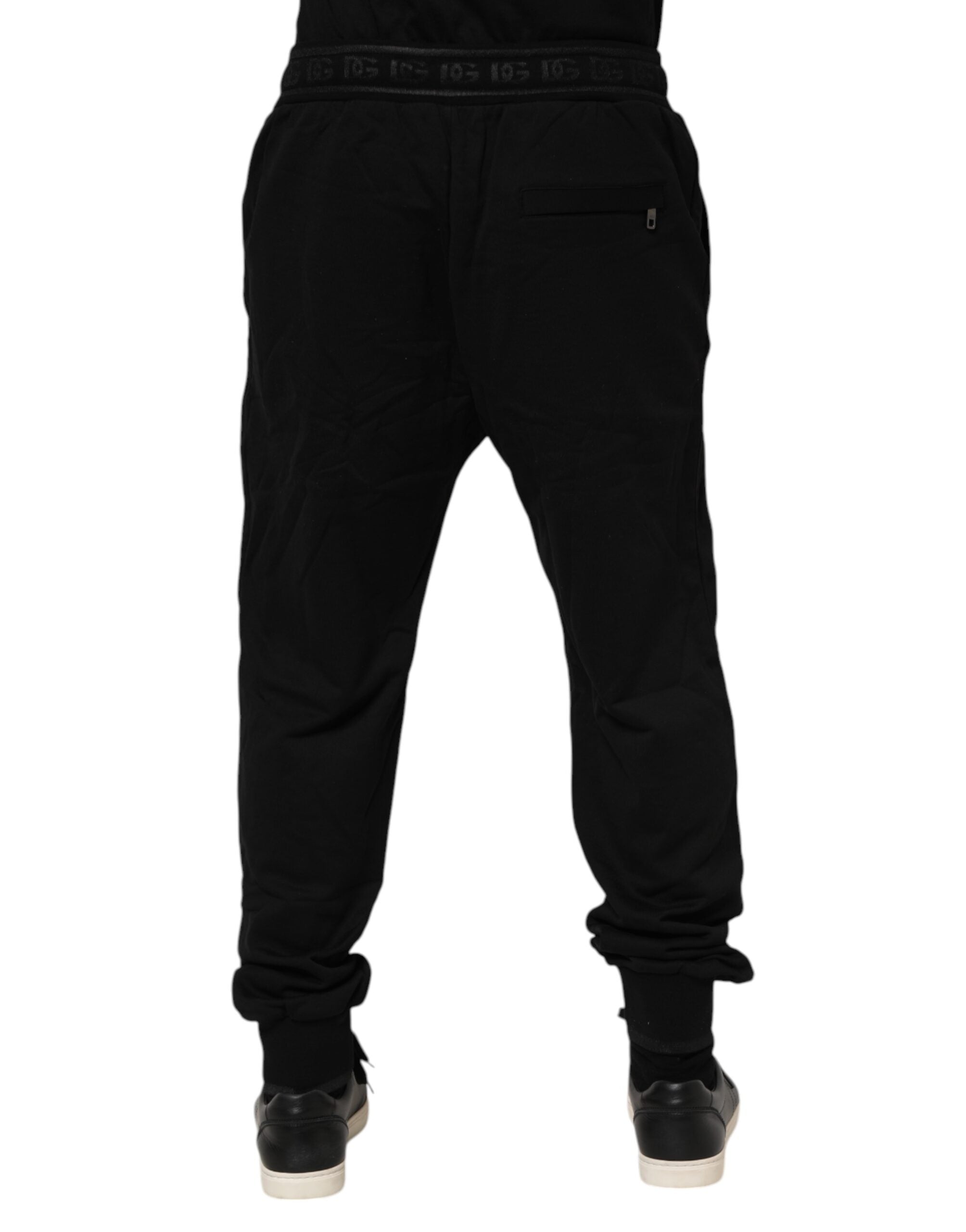 Pantalons jogger noirs en coton avec cordon de serrage de la marque Dolce & Gabbana, vue de face.