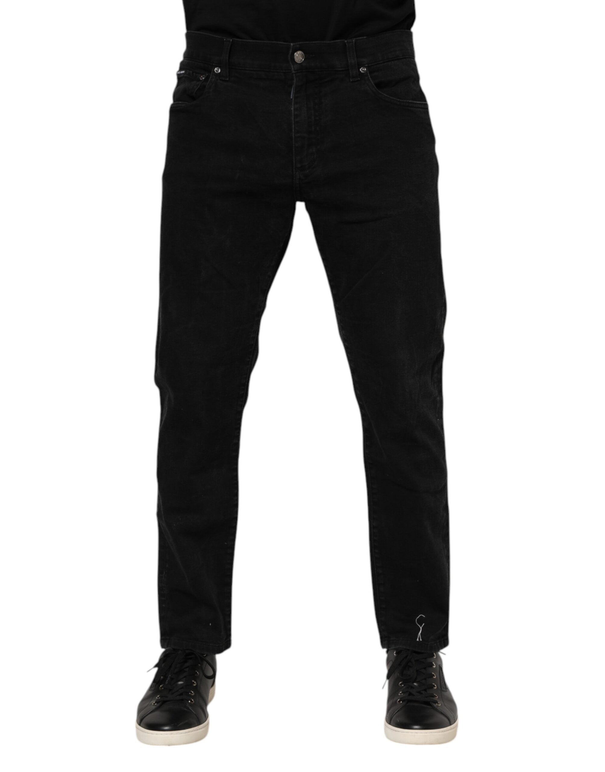 Jeans slim en denim noir Dolce & Gabbana avec plaque logo en coton et finition ajustée.