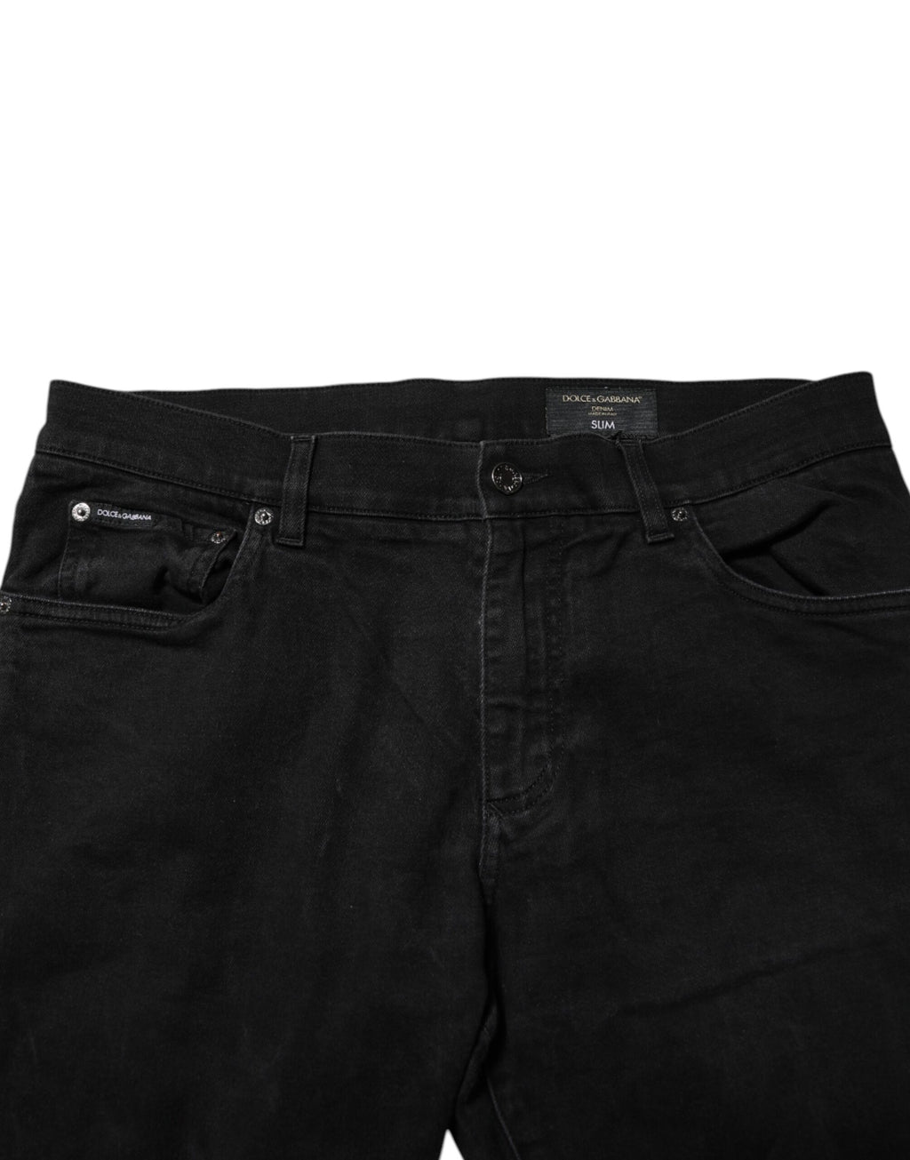 Jeans slim en denim noir Dolce & Gabbana avec plaque logo en coton, coupe ajustée et détails modernes.