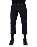 Jeans slim fit en denim bleu foncé pour homme de Dolce & Gabbana avec logo, en coton, visibles sur l'image.