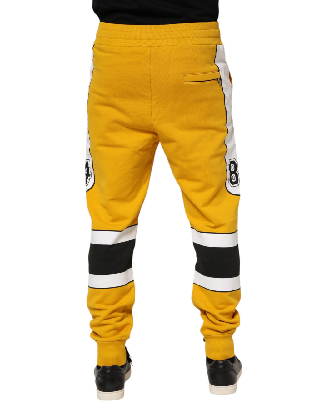Pantalons jogger jaunes imprimés avec cordon de serrage de Dolce & Gabbana, style décontracté et tendance.