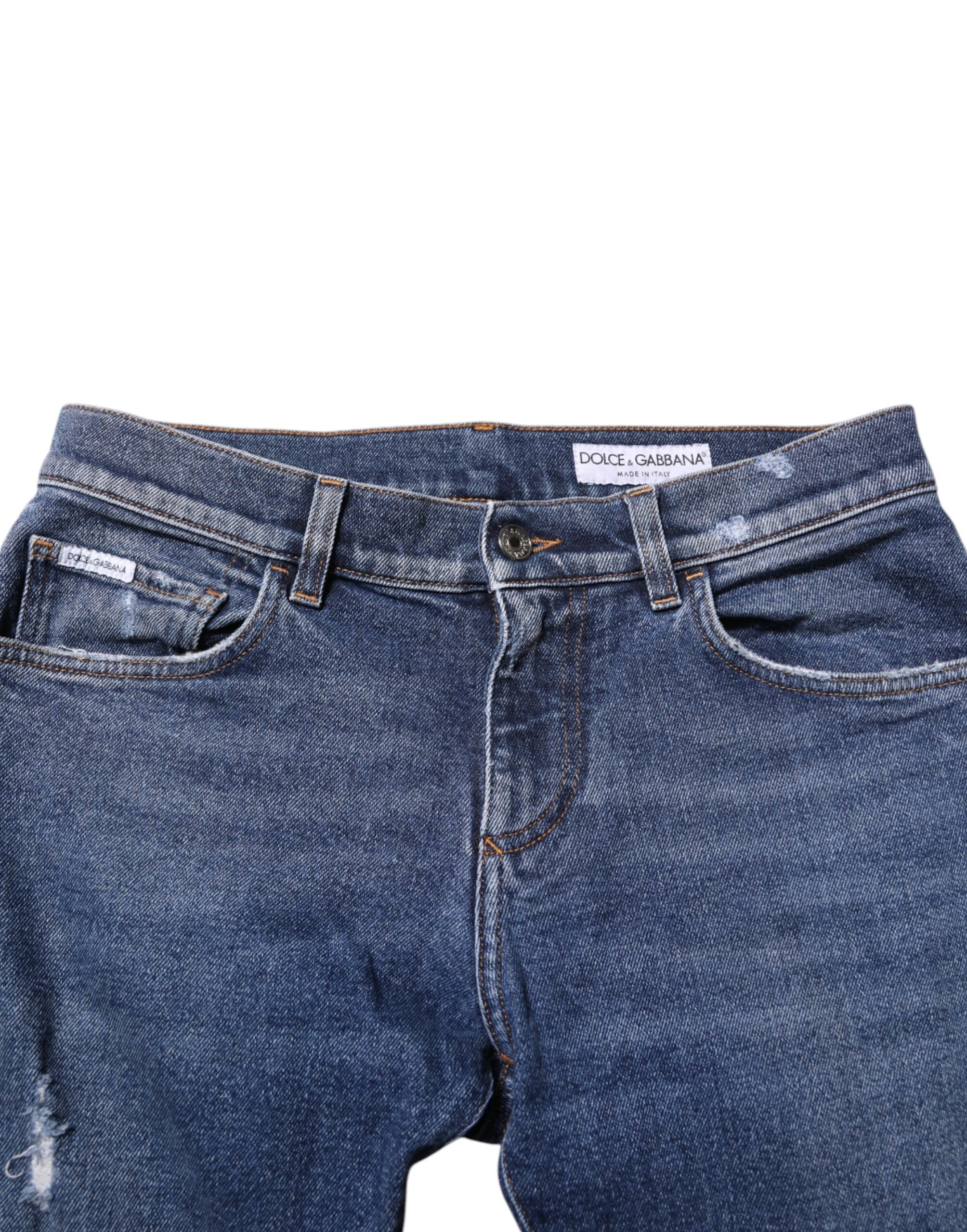 Jeans slim en denim bleu Dolce & Gabbana pour homme avec logo en plaque en coton, style tendance et ajusté.