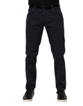 Jeans en denim bleu Dolce & Gabbana, coupe tapered, en coton, visible avec détails de couture et taille ajustée.