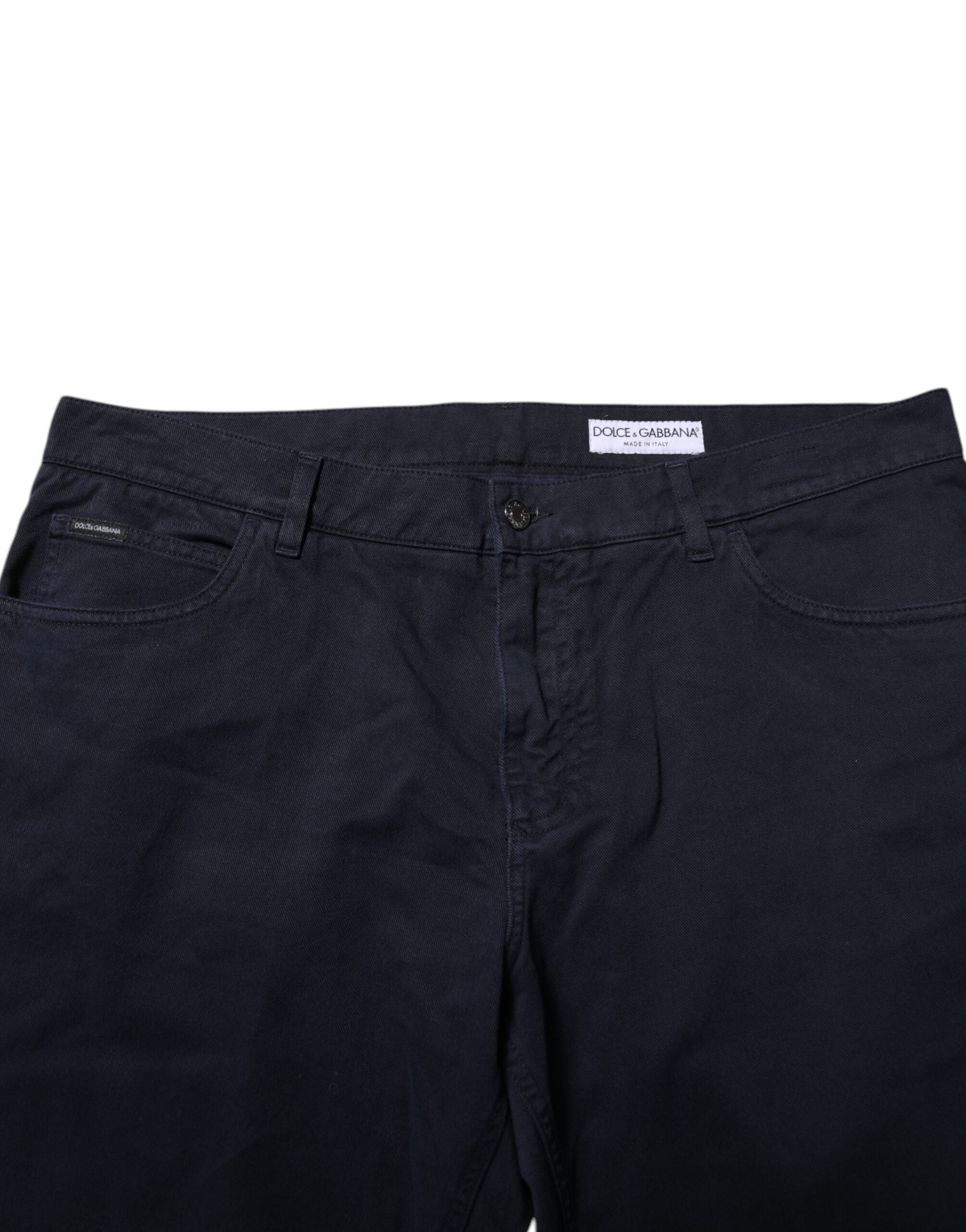 Jeans en denim noir Dolce & Gabbana, coupe tapered, en coton, visible avec détails de couture et fermeture éclair.