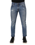 Jeans en denim bleu Dolce & Gabbana avec logo en plaque en coton, style confortable et tendance.