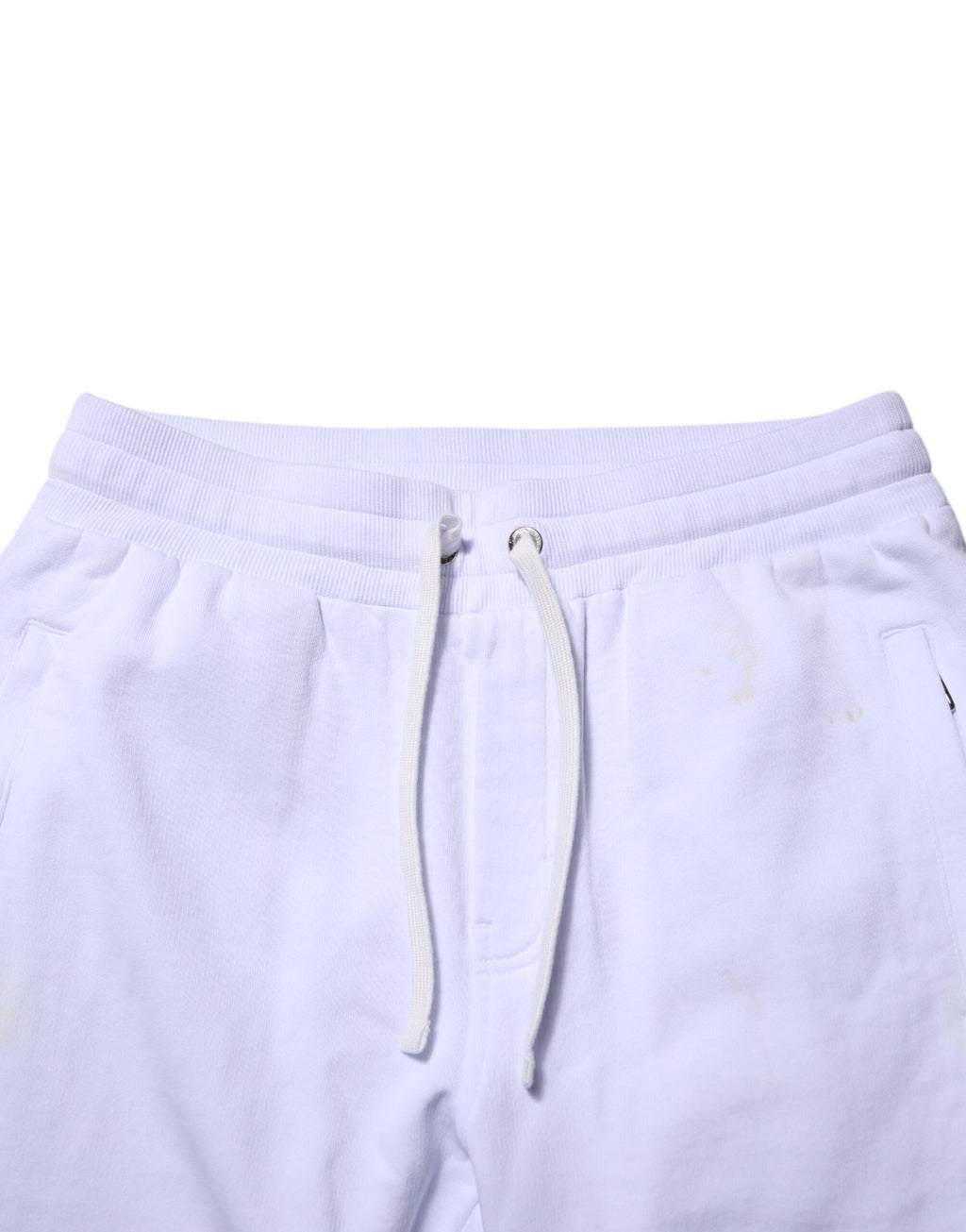 Pantalons jogger en coton blanc Dolce & Gabbana avec cordon de serrage et coupe décontractée, visibles en gros plan.