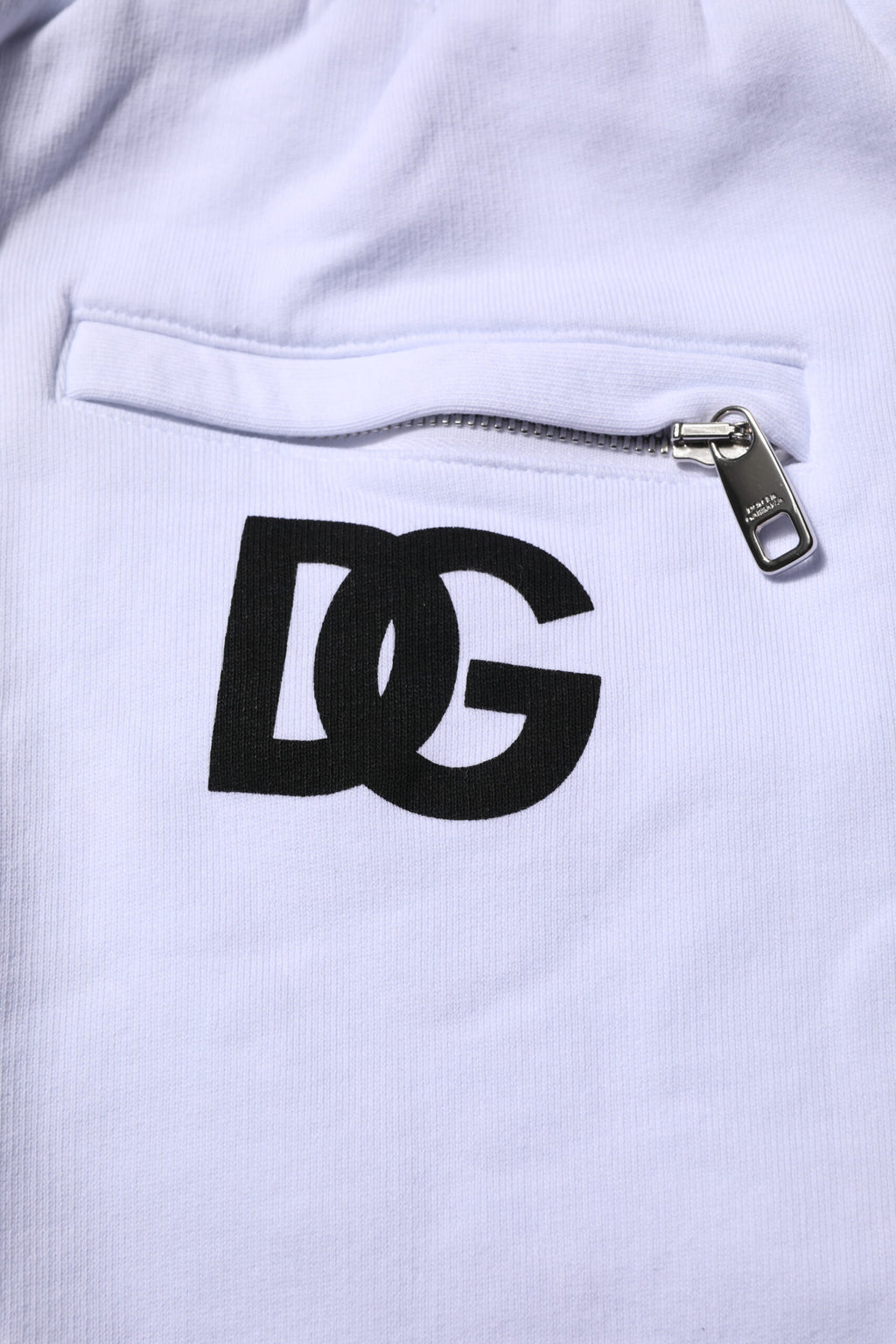 Pantalons jogger en coton blanc avec cordon de serrage de la marque Dolce & Gabbana, vue de face.