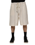 Shorts bermuda en coton ivoire pour homme de Dolce & Gabbana, sweatshorts décontractés avec logo discret.