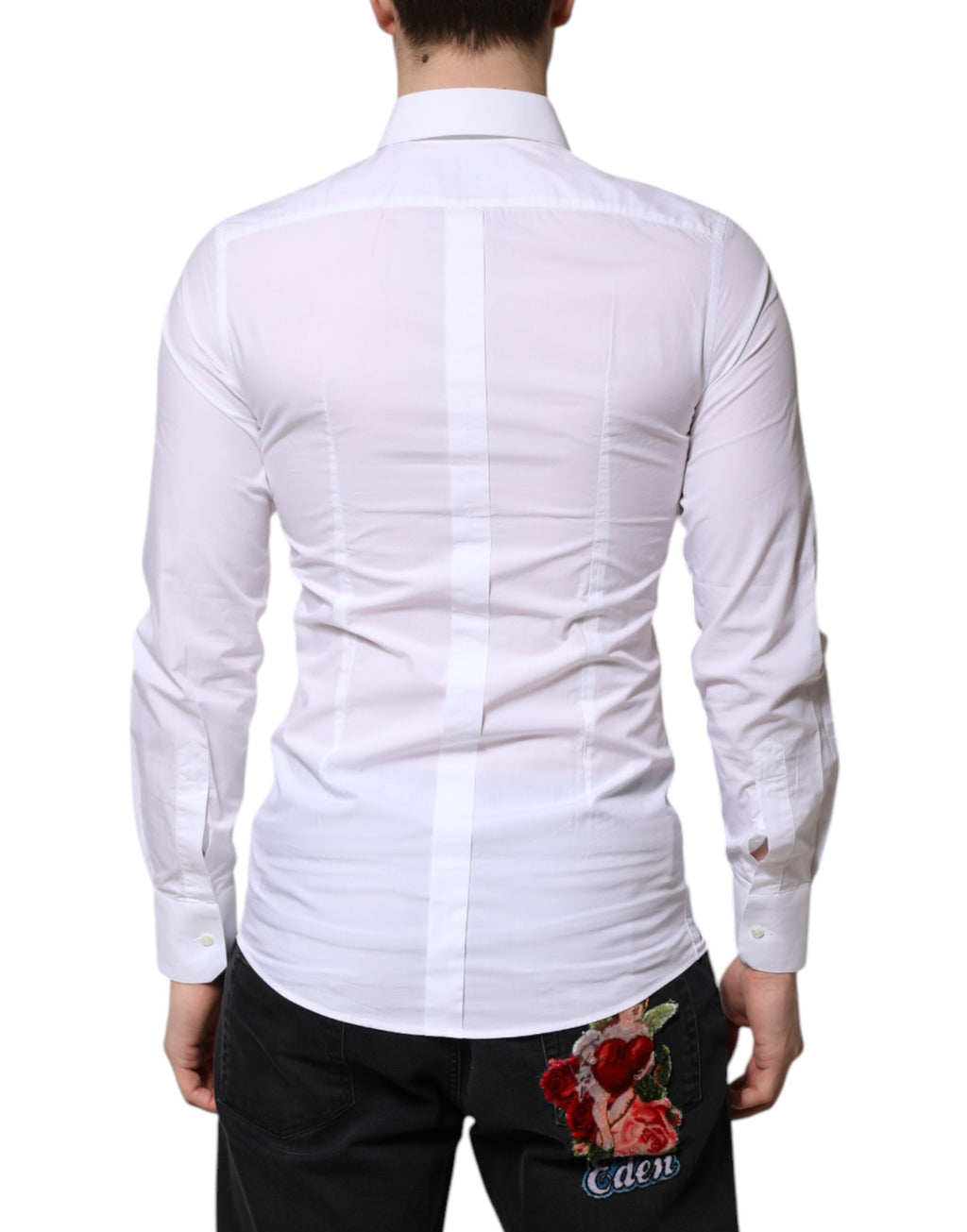 Chemise formelle blanche en coton Dolce & Gabbana avec manches longues et détails dorés visibles sur l'image.